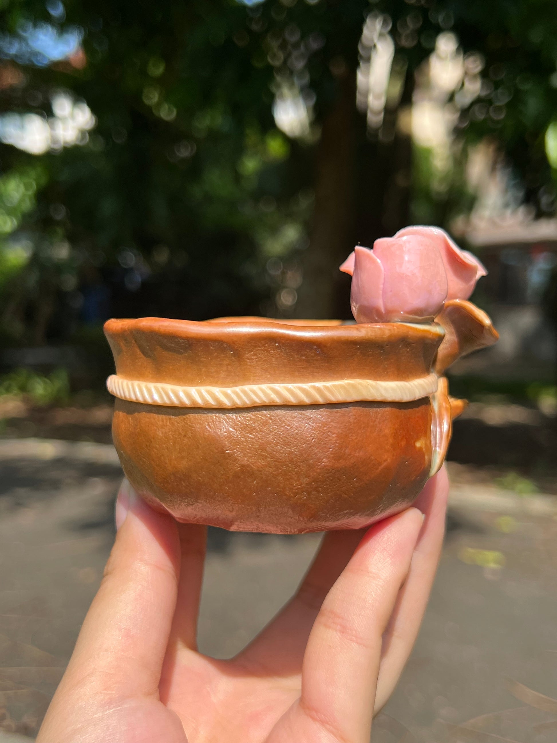 This is a woodfired pottery flower teacup