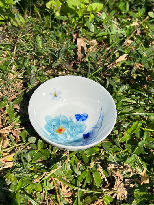 This is a Chinese Jingdezhen blue and white porcelain peony flower teacup