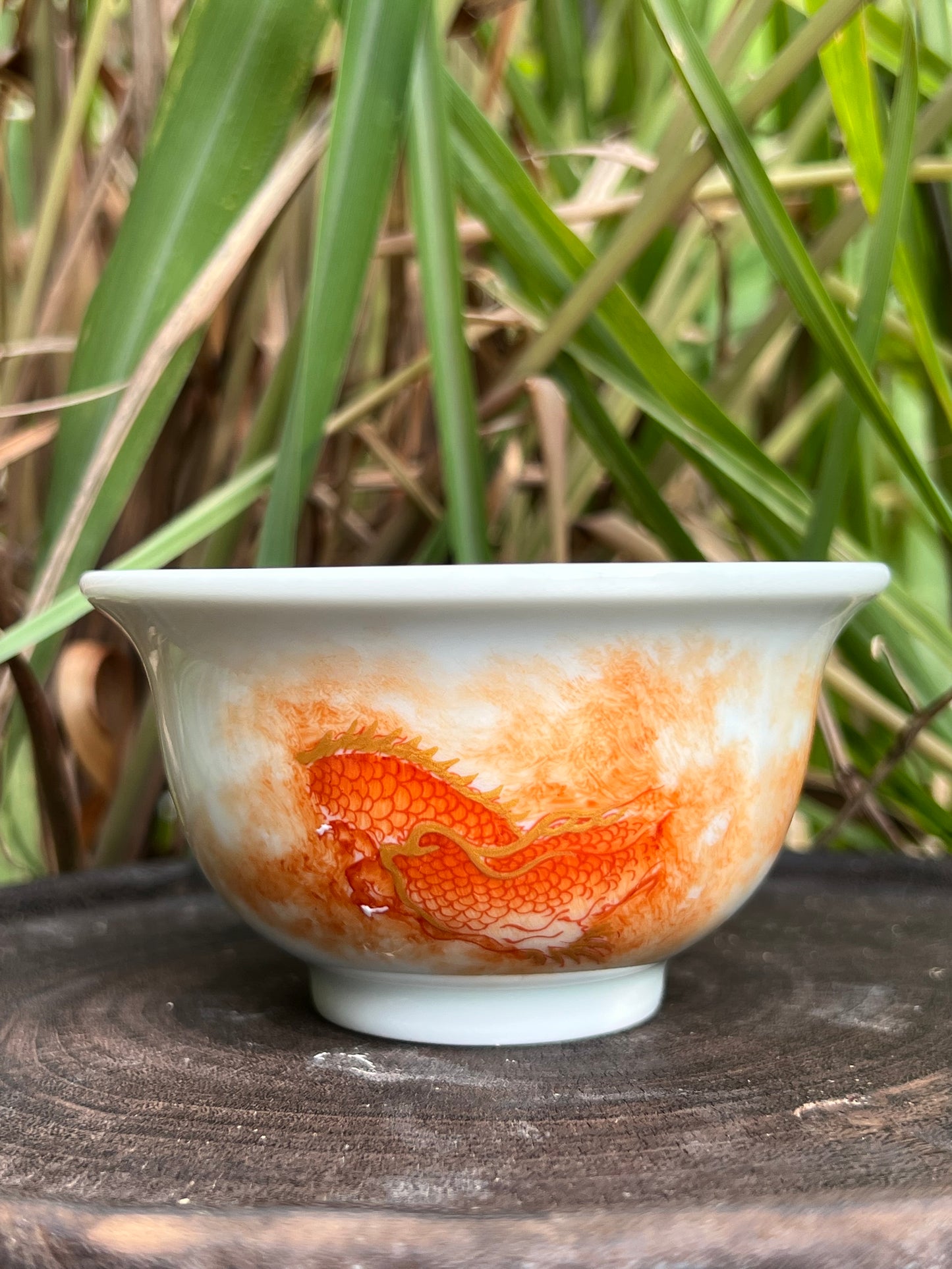 this is a Chinese Jingdezhen alum red dragon phoenix teacup. this is a ceramic teacup