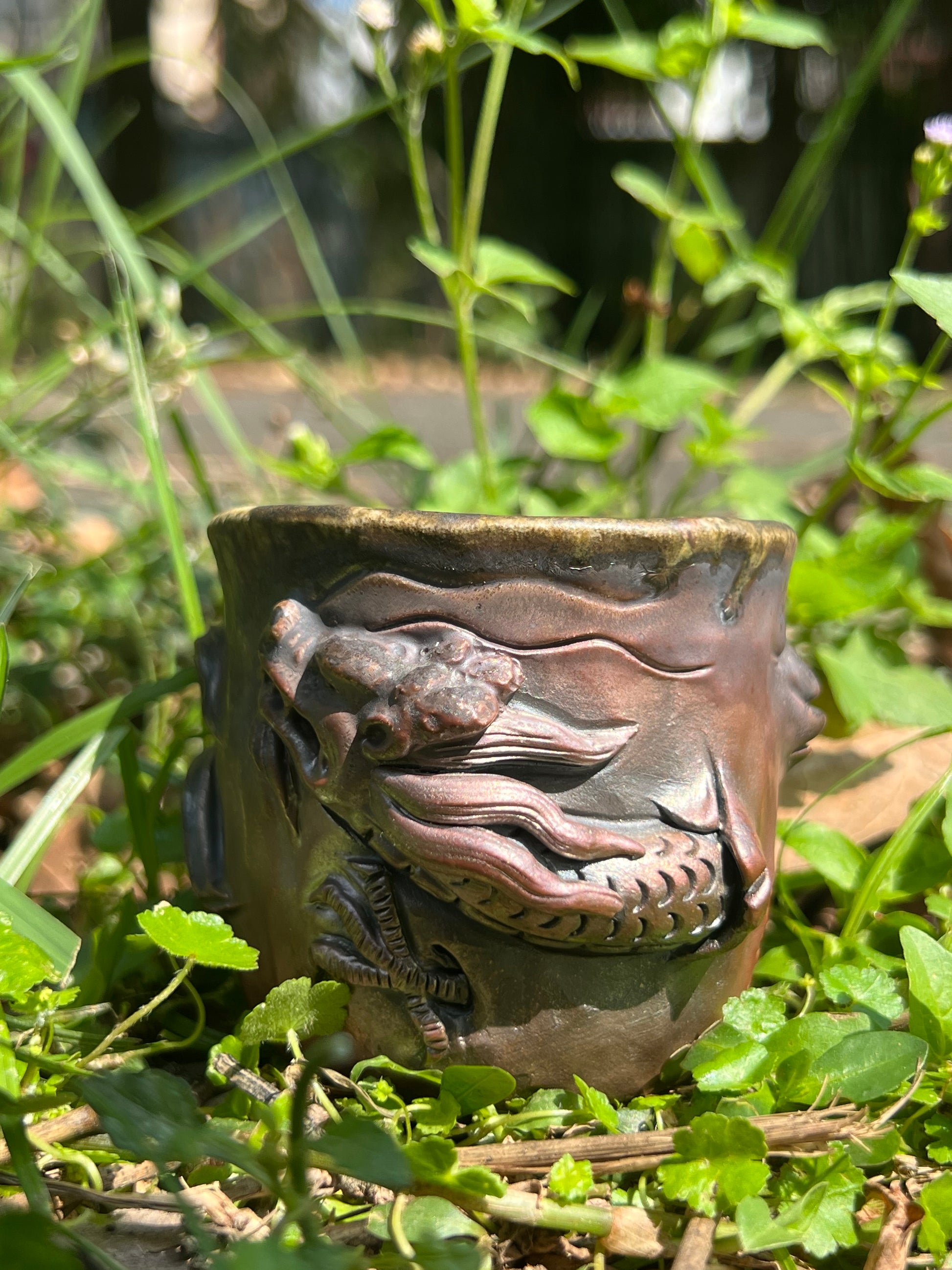 This is a woodfired tietai pottery dragon teacup