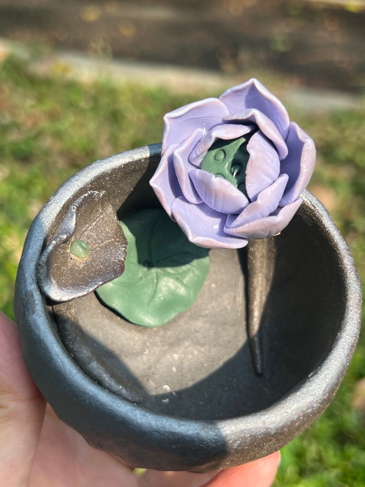 This is a woodfired tietai pottery flower teacup