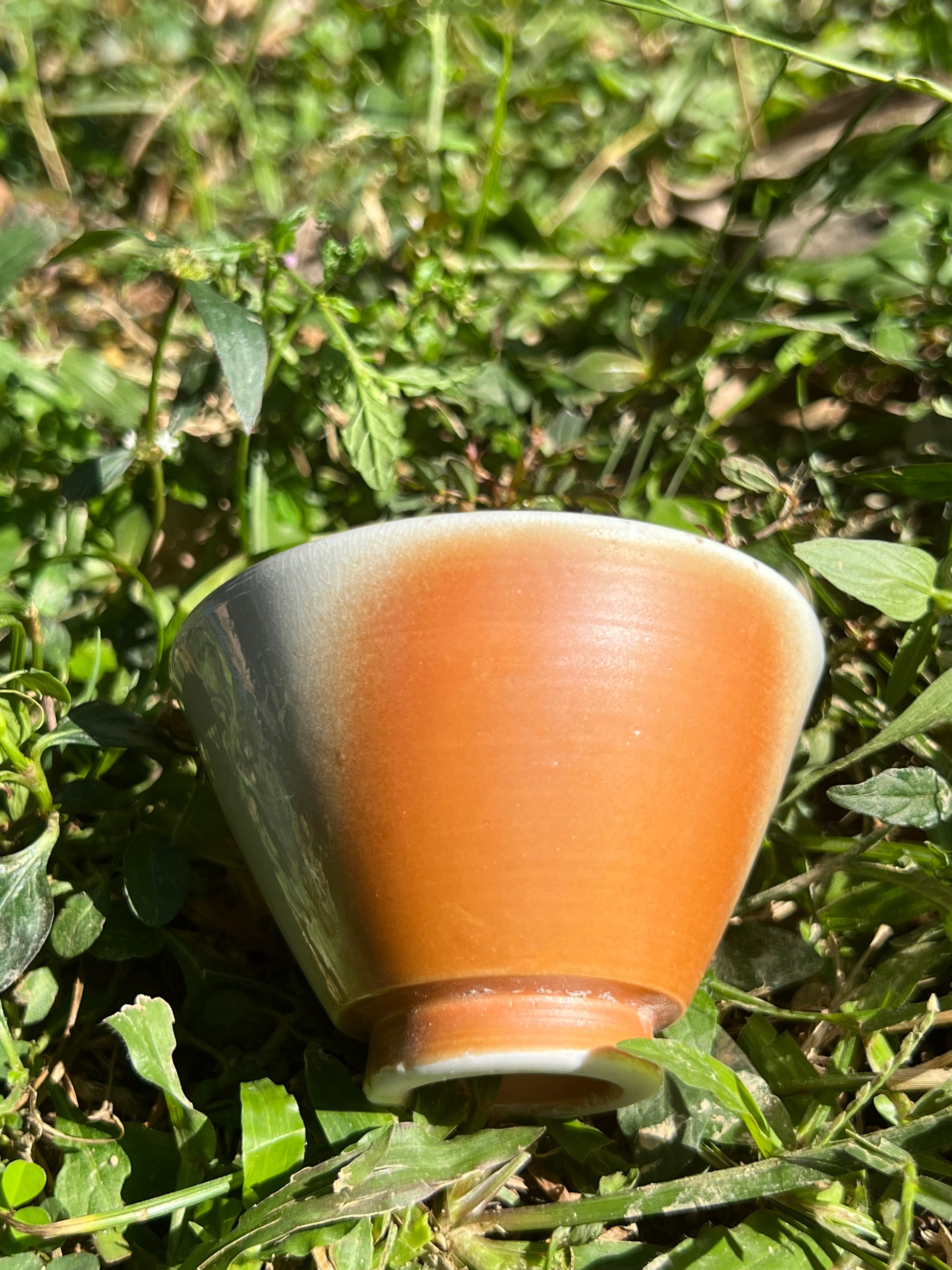 This is a woodfired pottery flower teacup