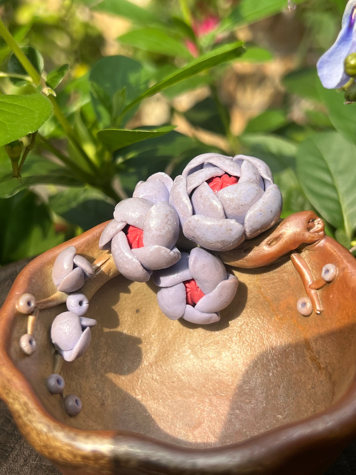 This is a woodfired pottery flower teacup