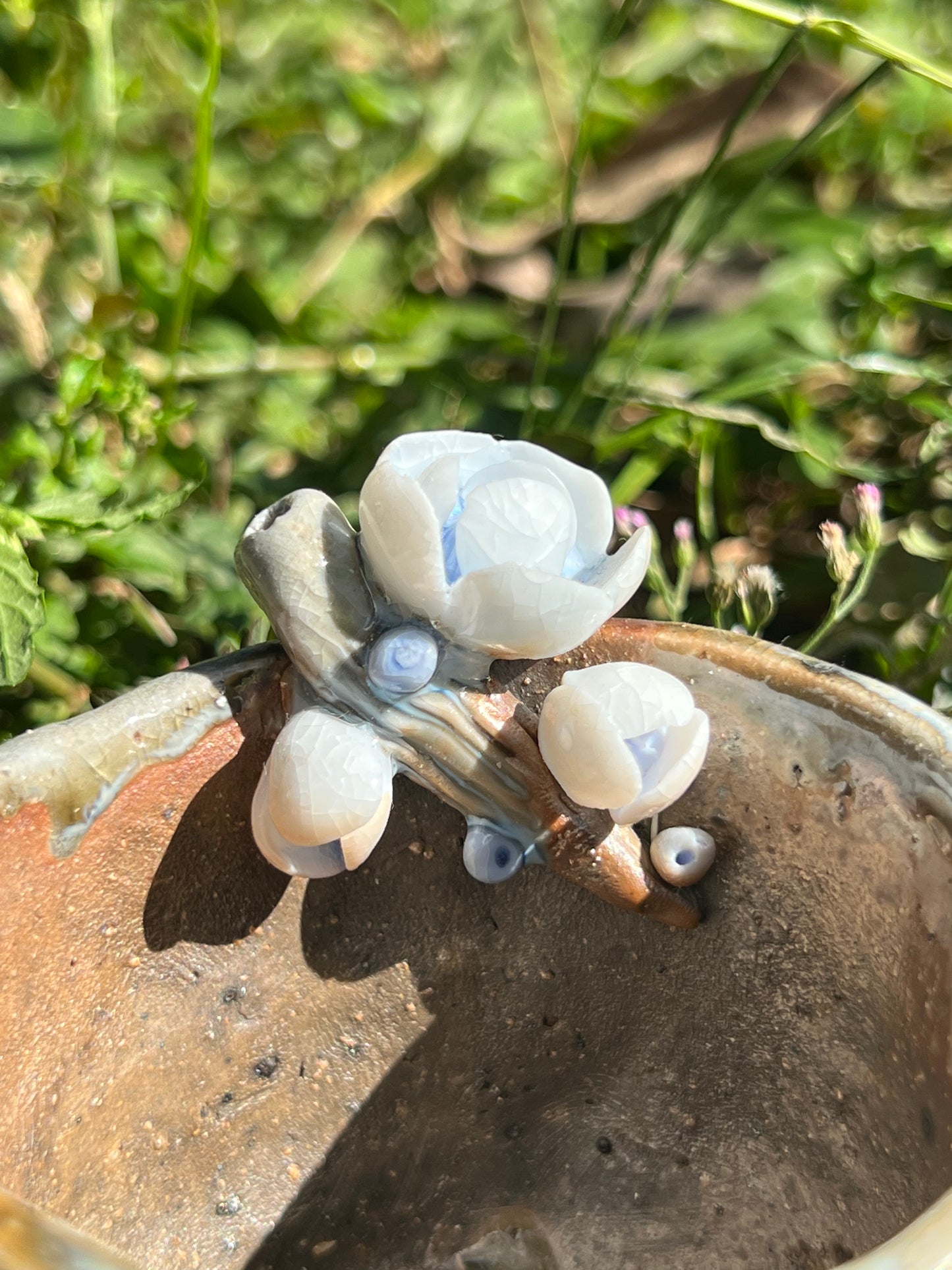 This is a woodfired pottery flower teacup