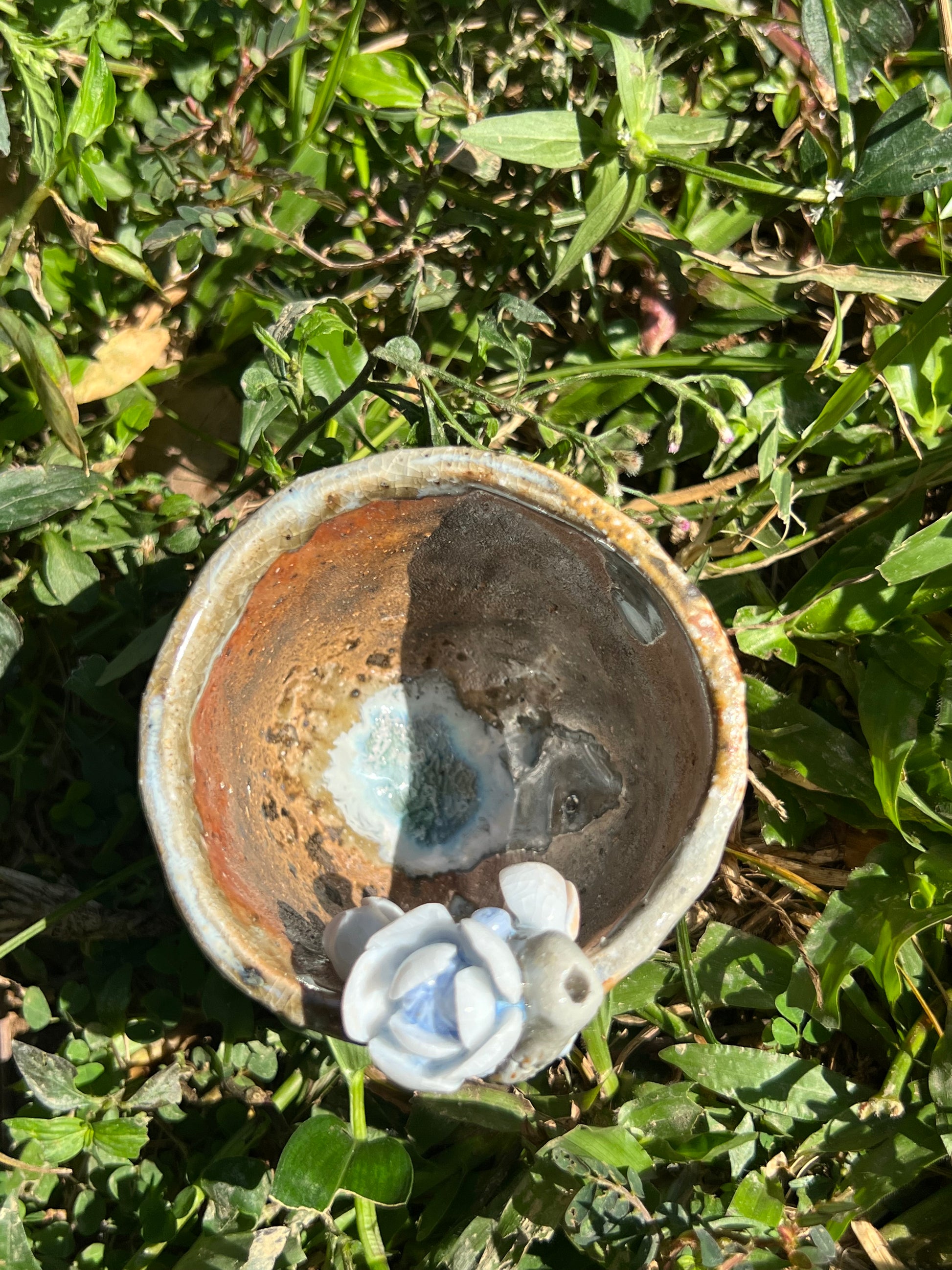 This is a woodfired pottery flower teacup