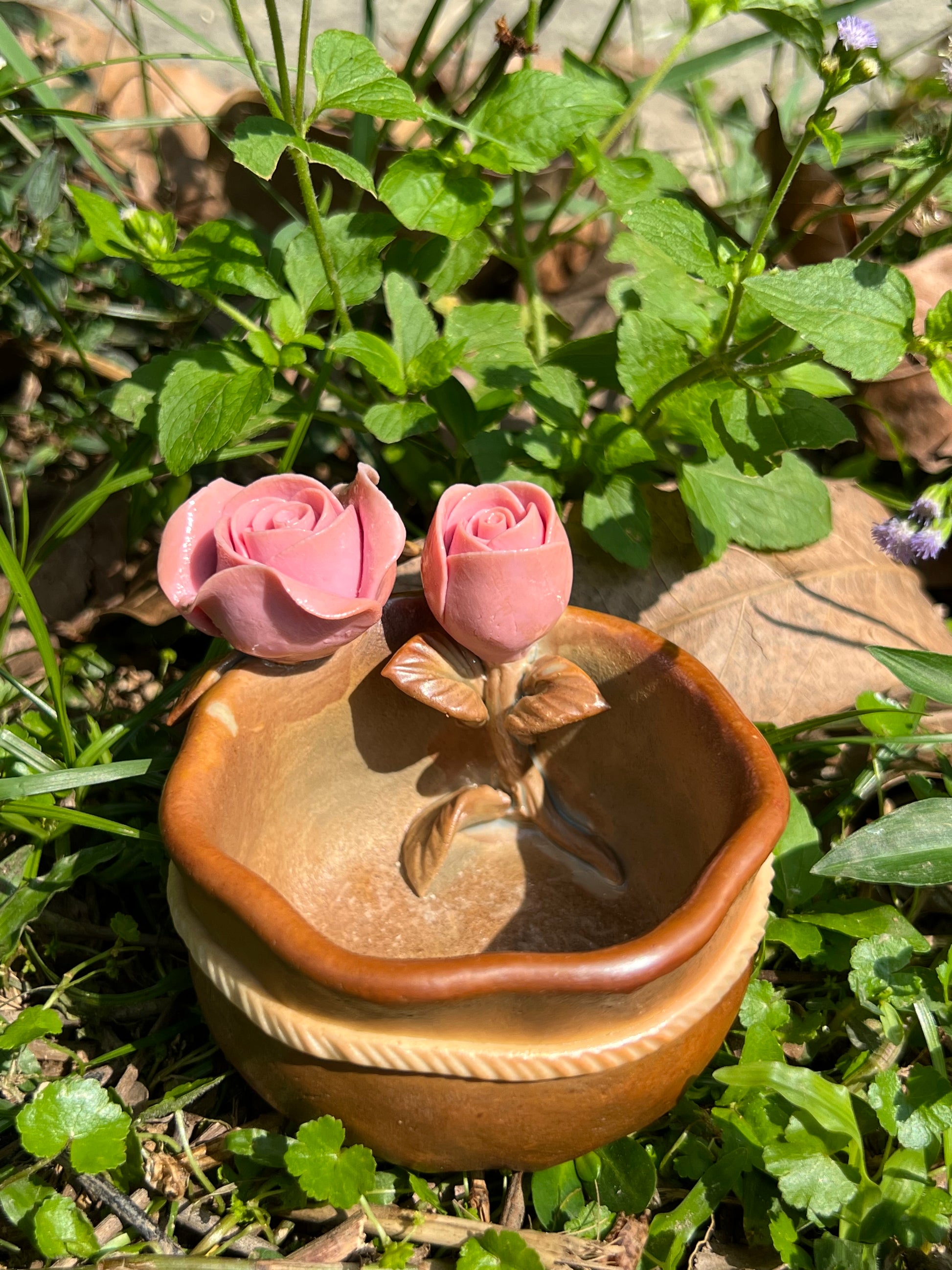 This is a woodfired pottery flower teacup