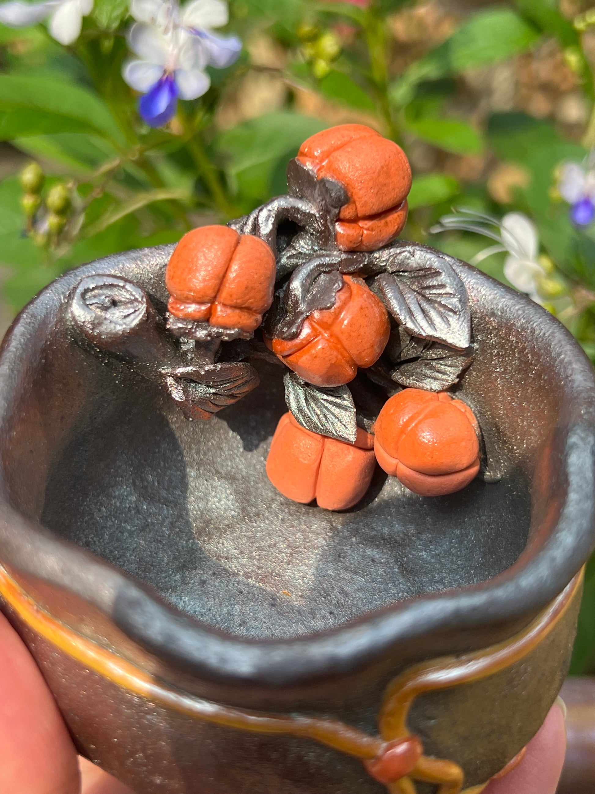 This is a woodfired tietai pottery flower teacup