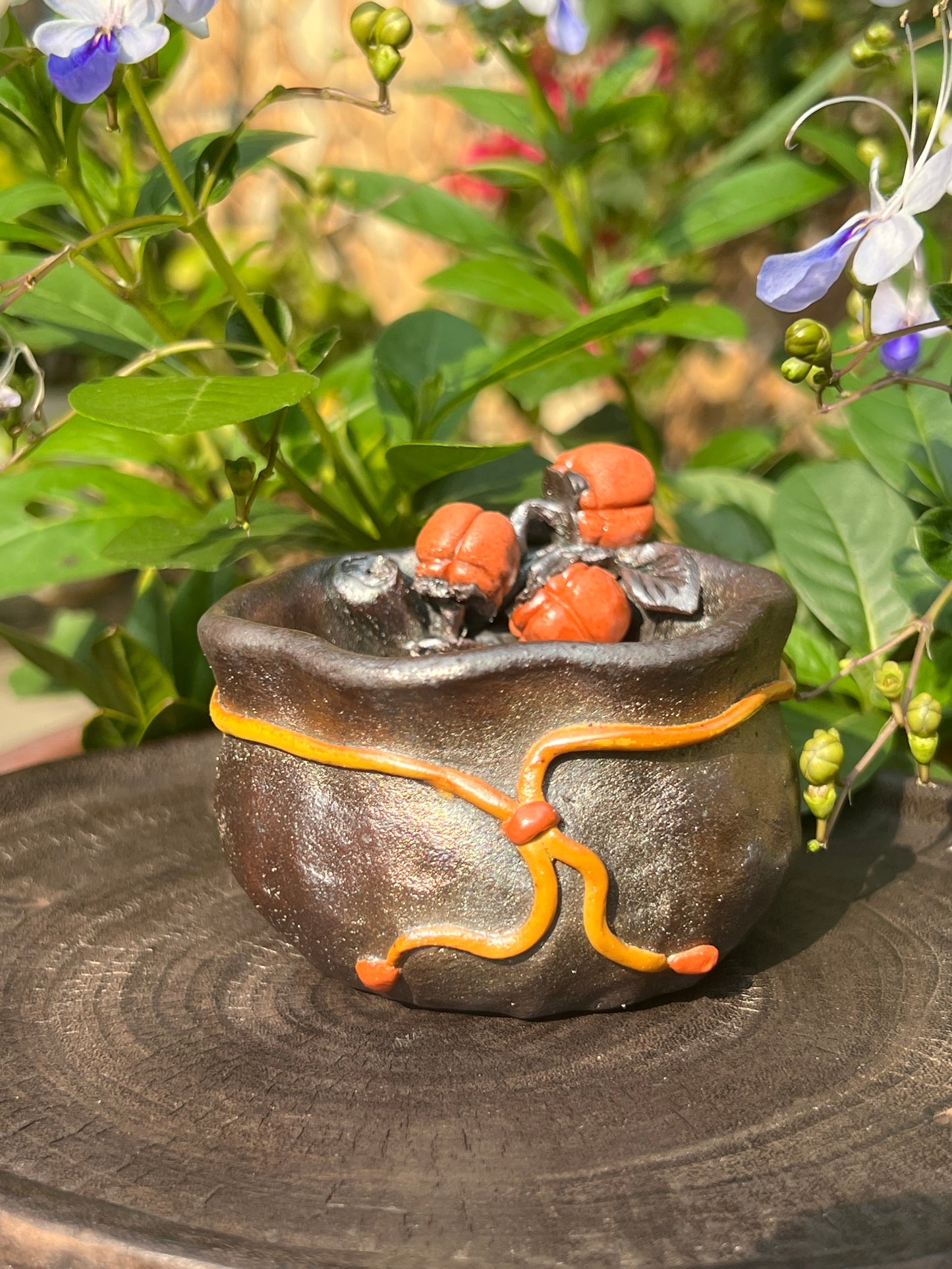 This is a woodfired tietai pottery flower teacup