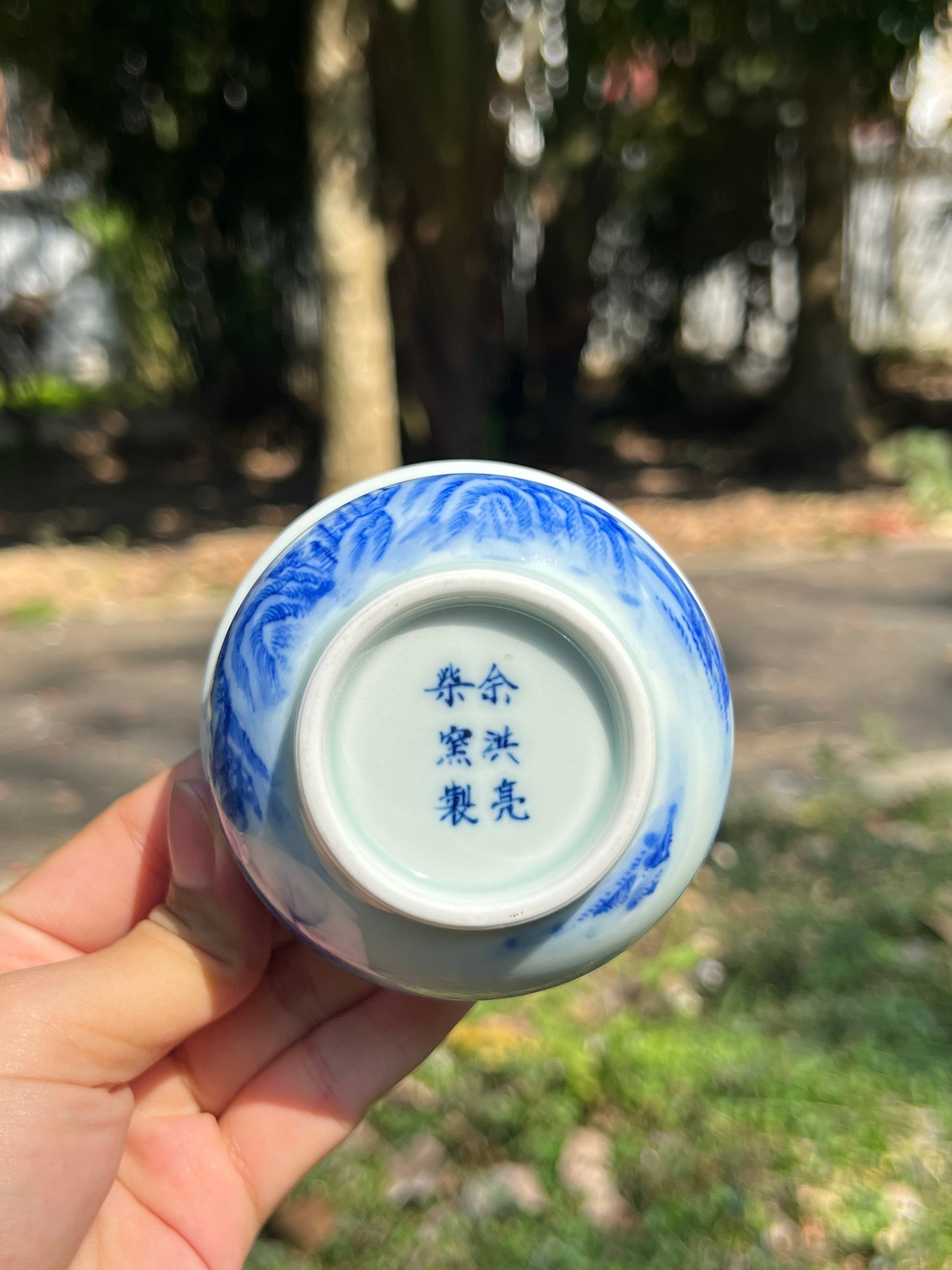 This is a Chinese Jingdezhen blue and white porcelain landscape teacup