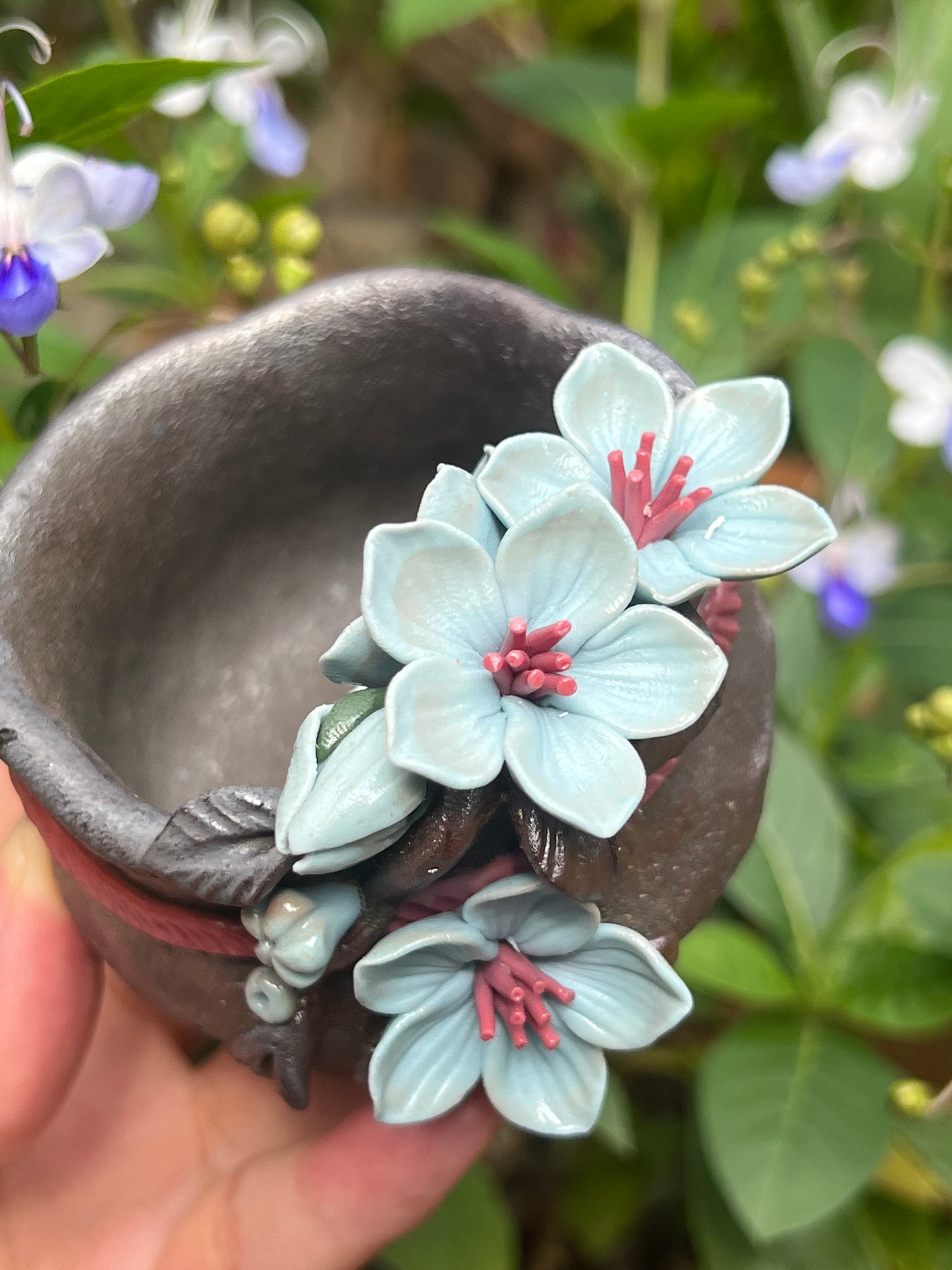 This is a woodfired tietai pottery flower teacup