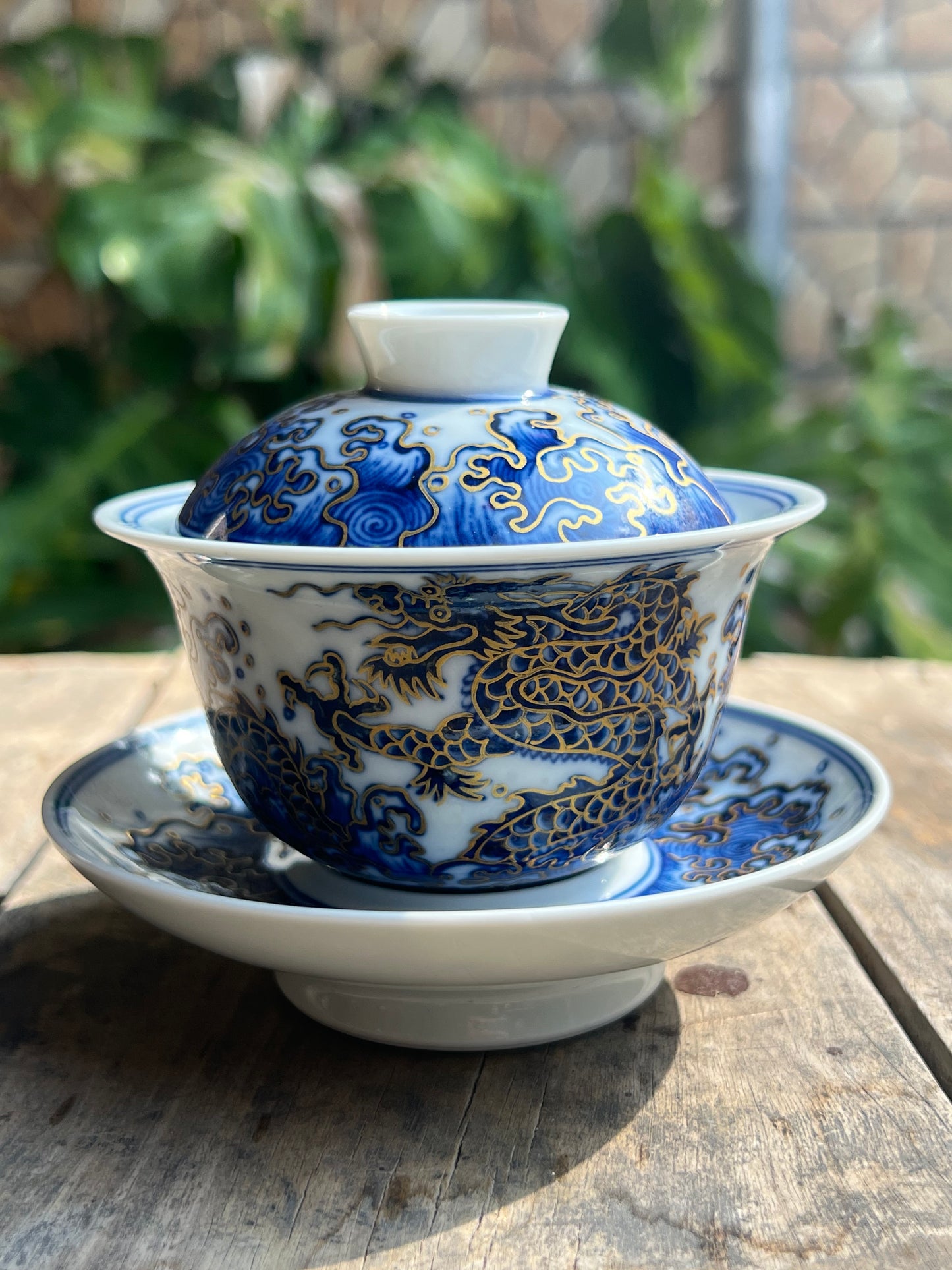 This is a Chinese Jingdezhen blue and white porcelain dragon teapot gaiwan