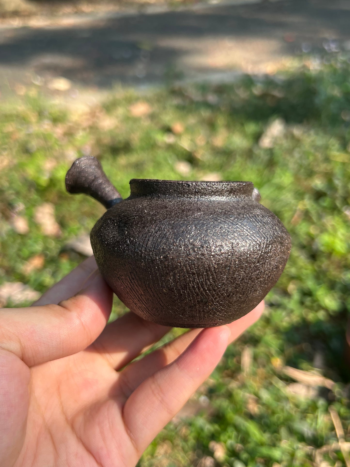 This is a pottery teapot