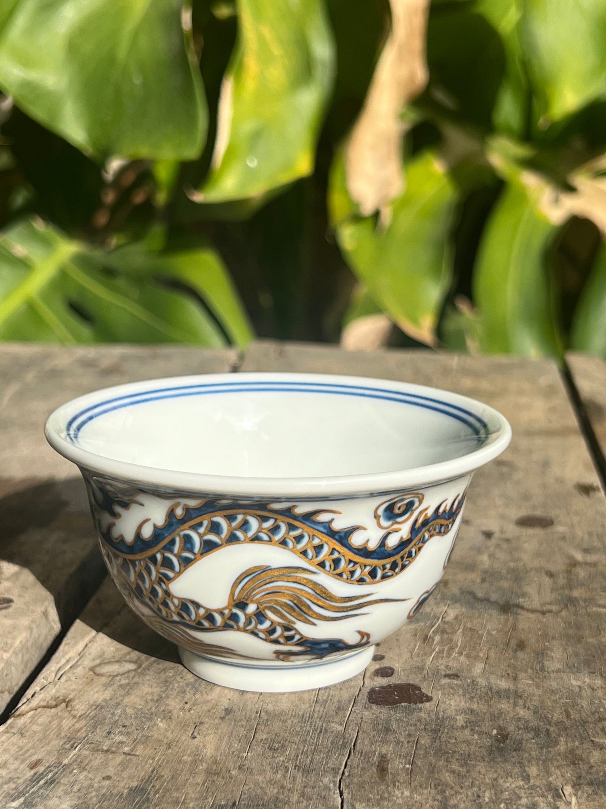 This is a Chinese Jingdezhen blue and white porcelain dragon tea cup