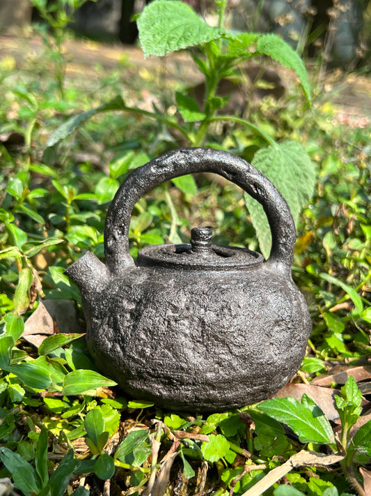 this is a purple clay teapot