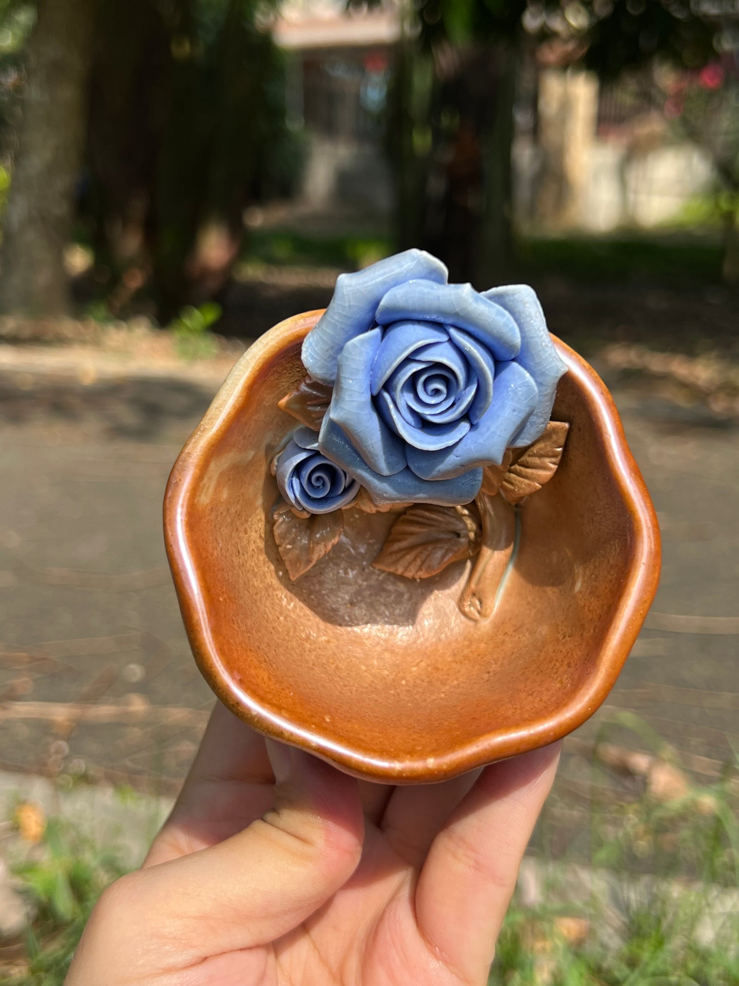 This is a woodfired pottery flower teacup