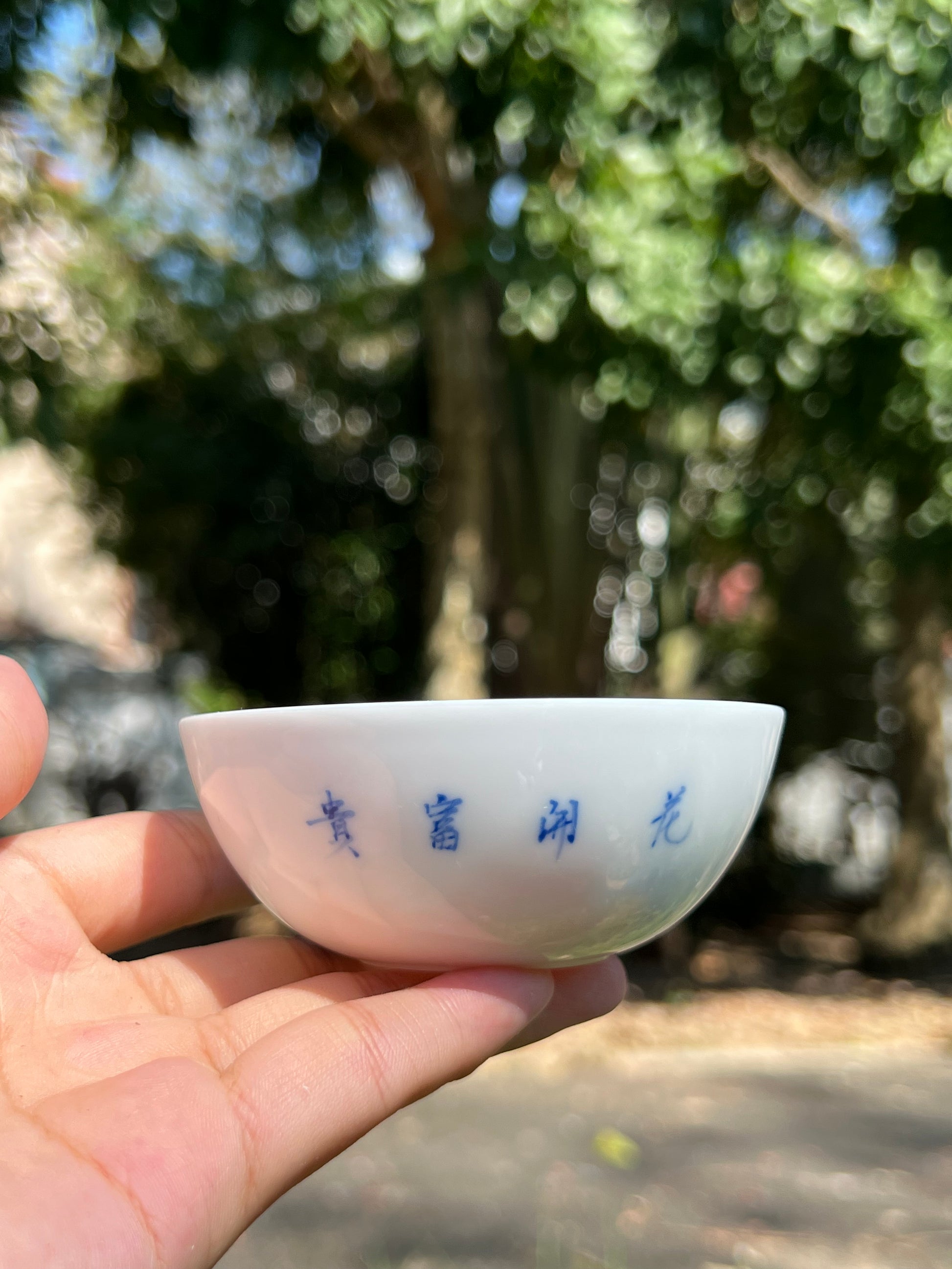 This is a Chinese Jingdezhen blue and white porcelain peony flower teacup