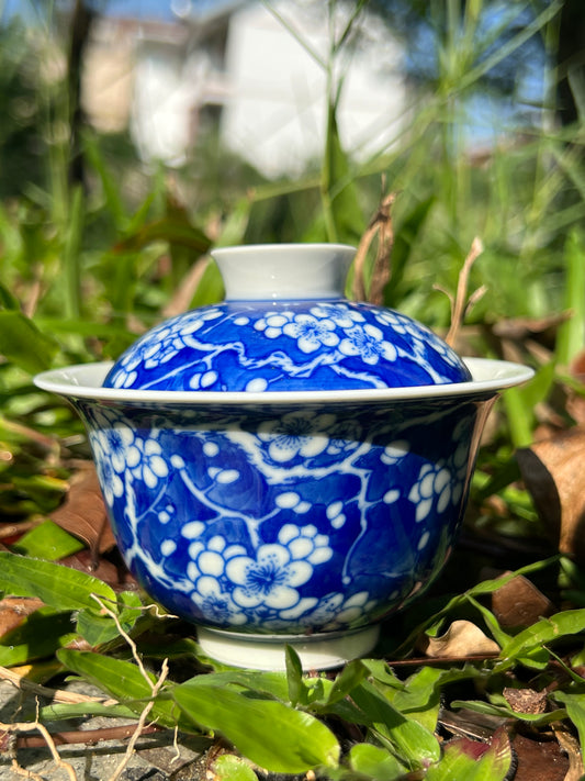 This is Chinese Jingdezhen blue and white porcelain gaiwan. This is a ceramic plum flower teapot