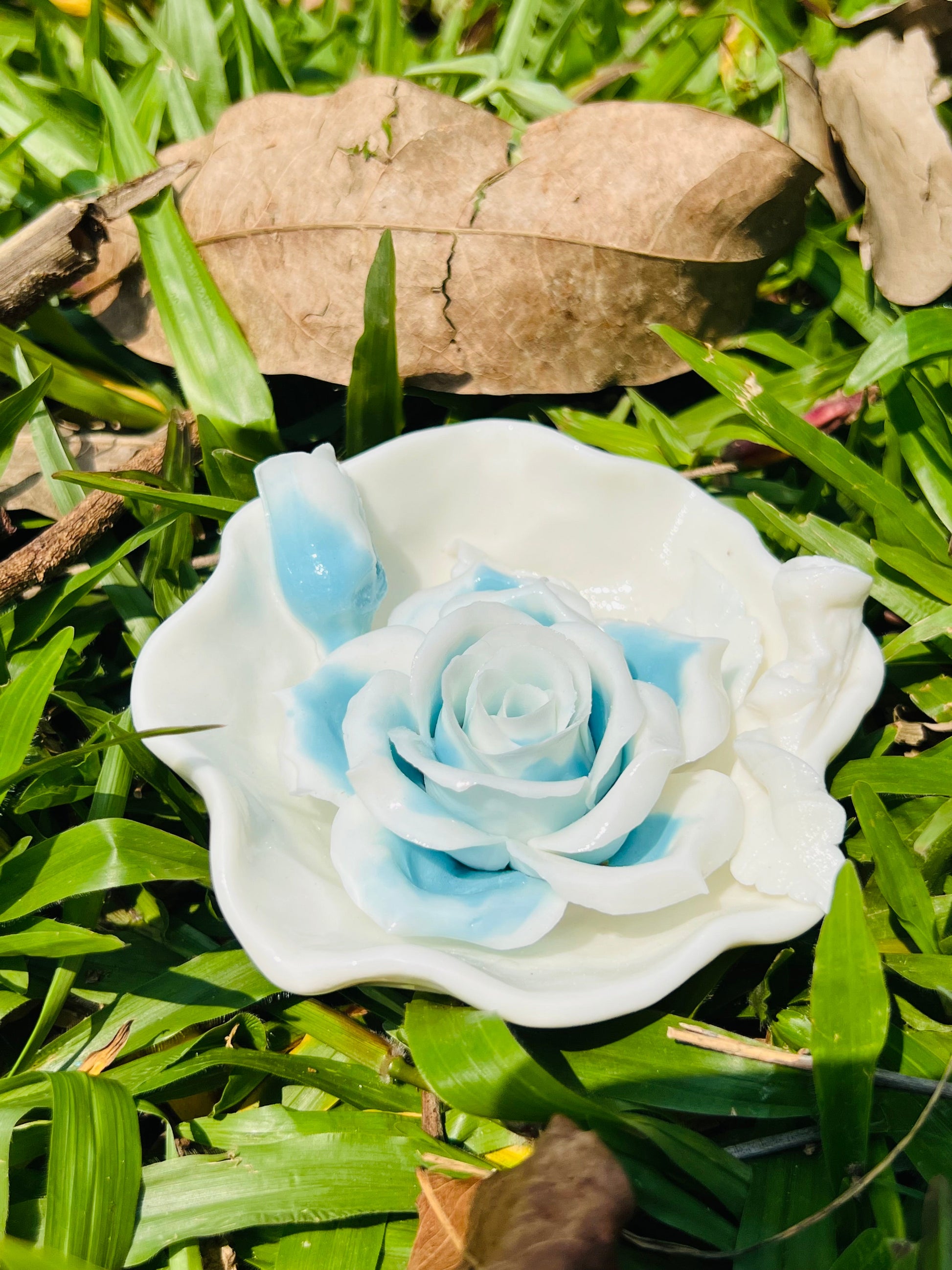 this is a woodfired white fine pottery flower teacup