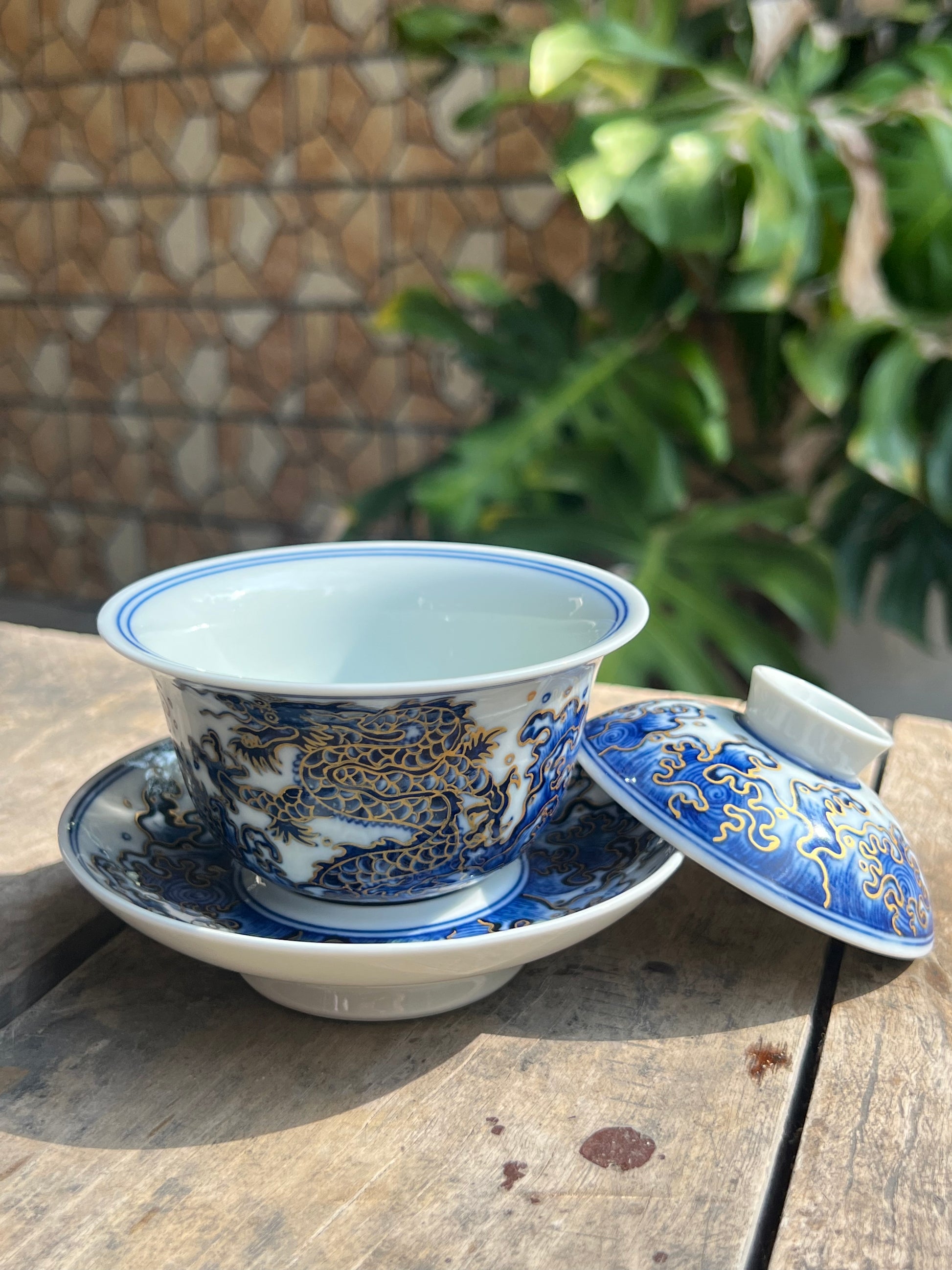 This is a Chinese Jingdezhen blue and white porcelain dragon teapot gaiwan