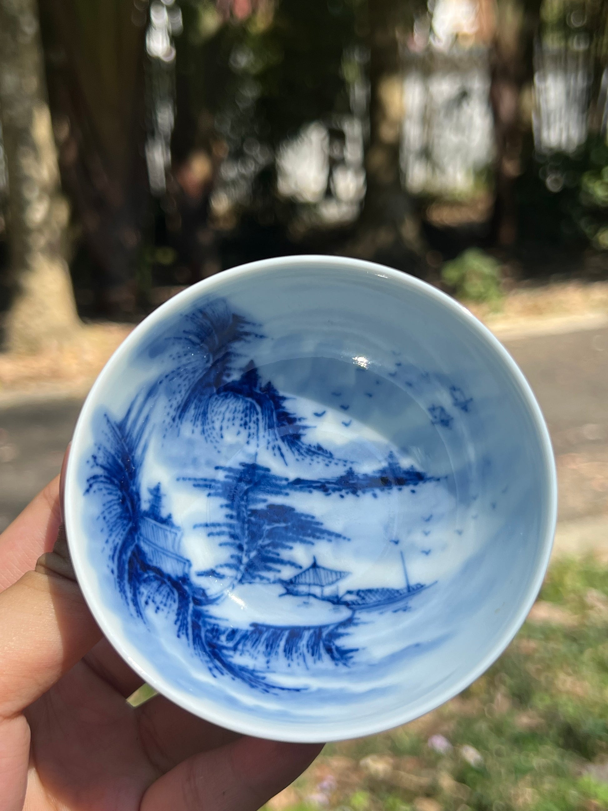 This is a Chinese Jingdezhen blue and white porcelain landscape teacup