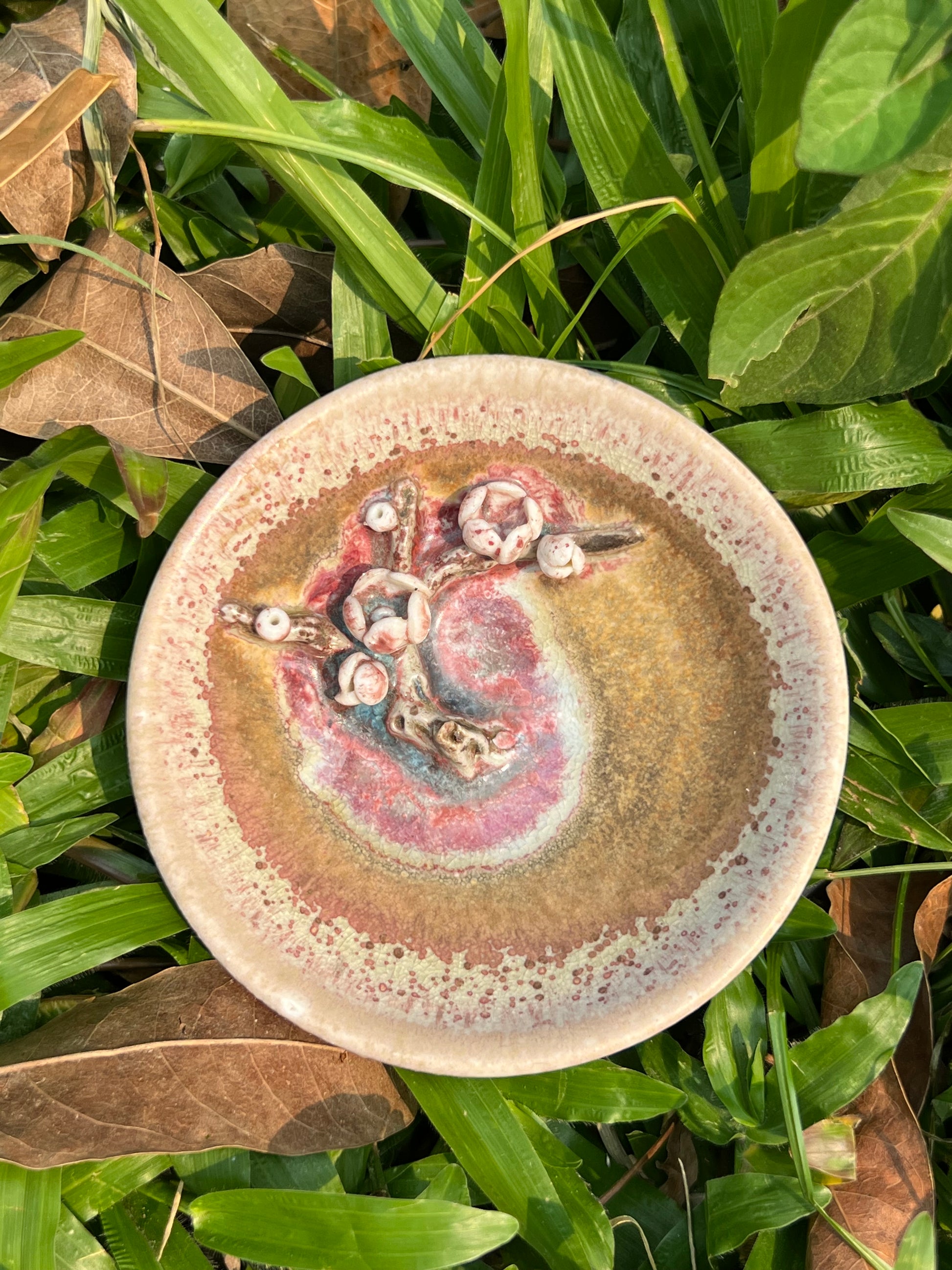 This is a woodfired pottery flower teacup