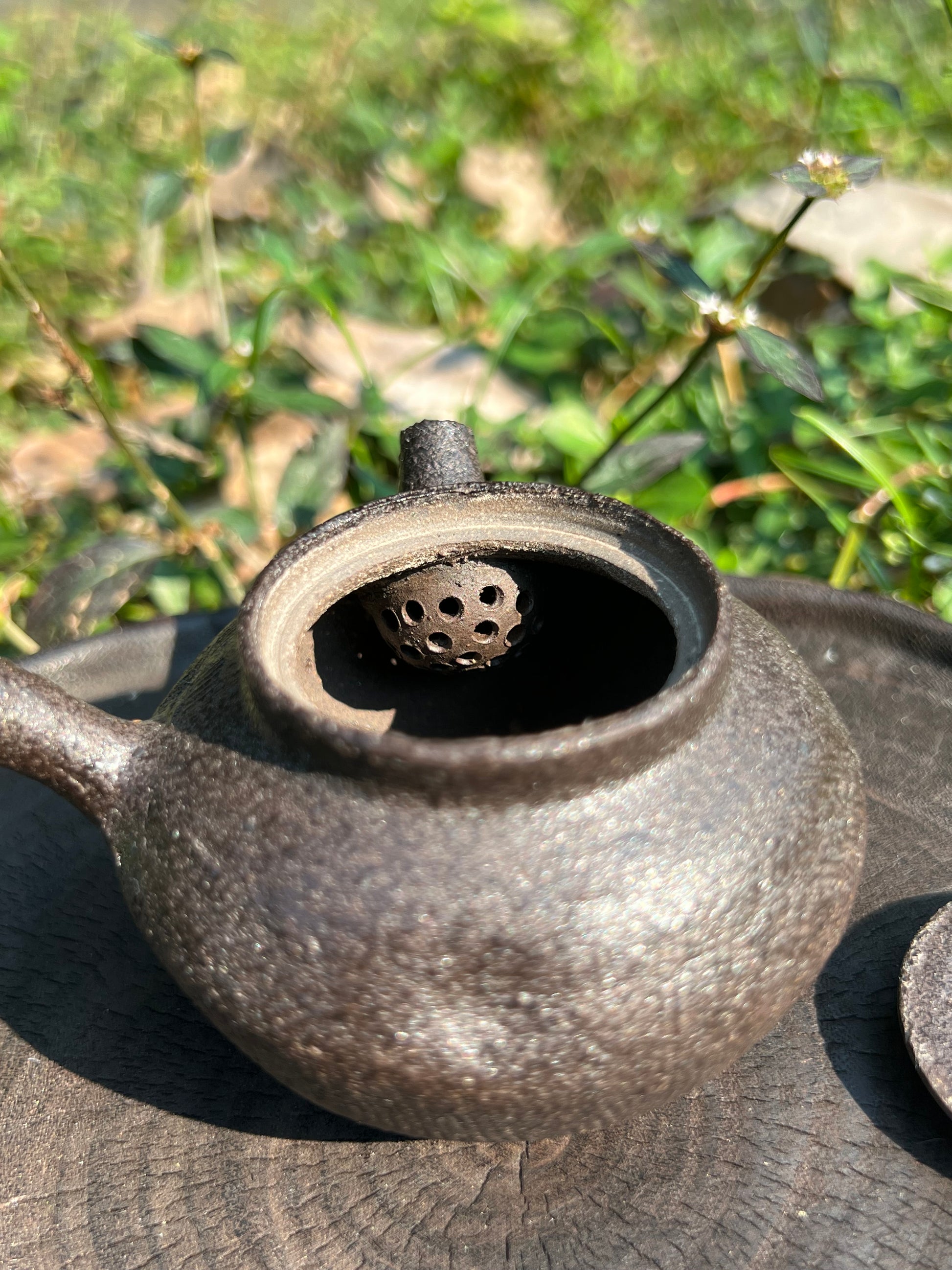 This is a pottery teapot