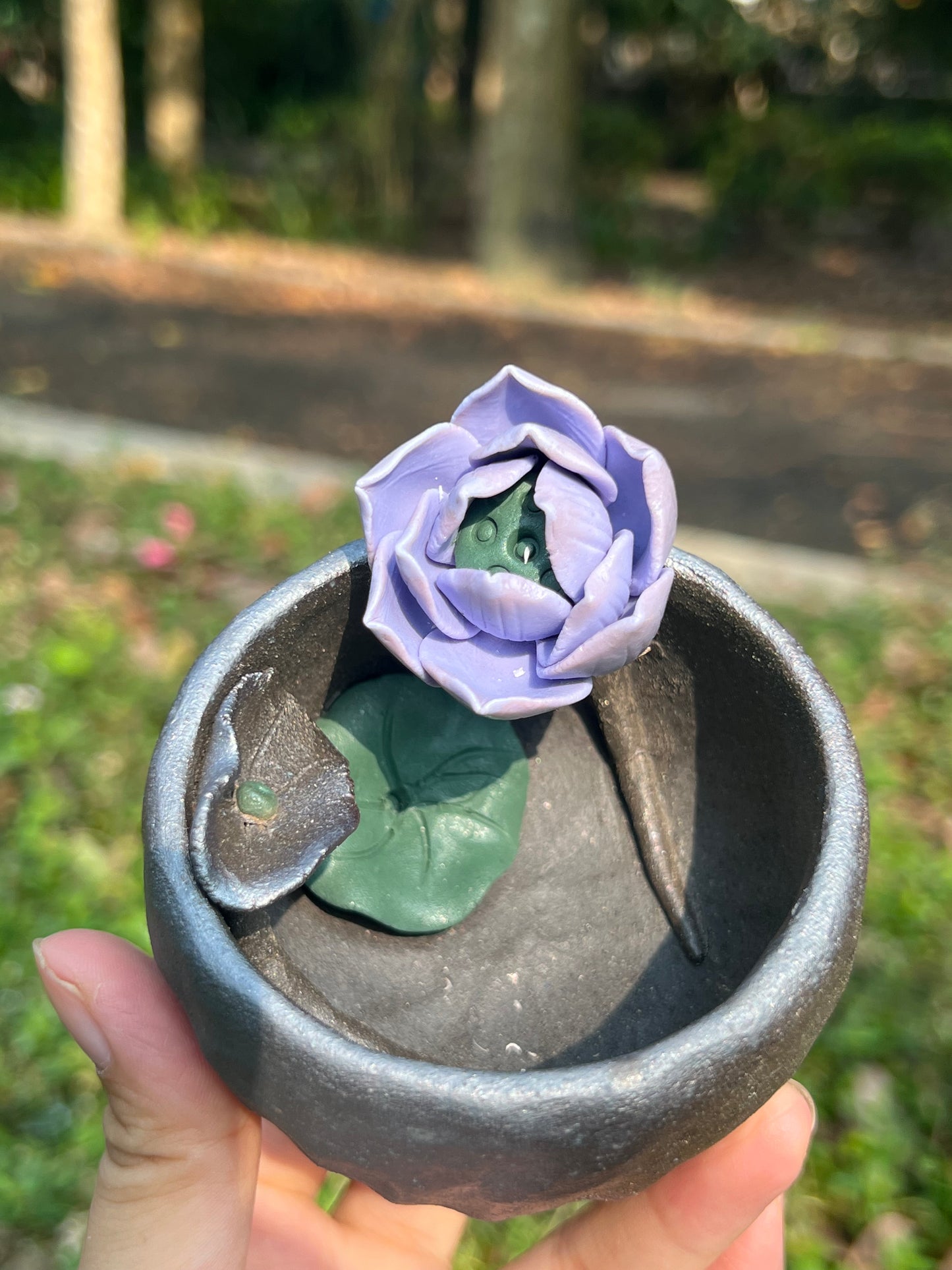 This is a woodfired tietai pottery flower teacup