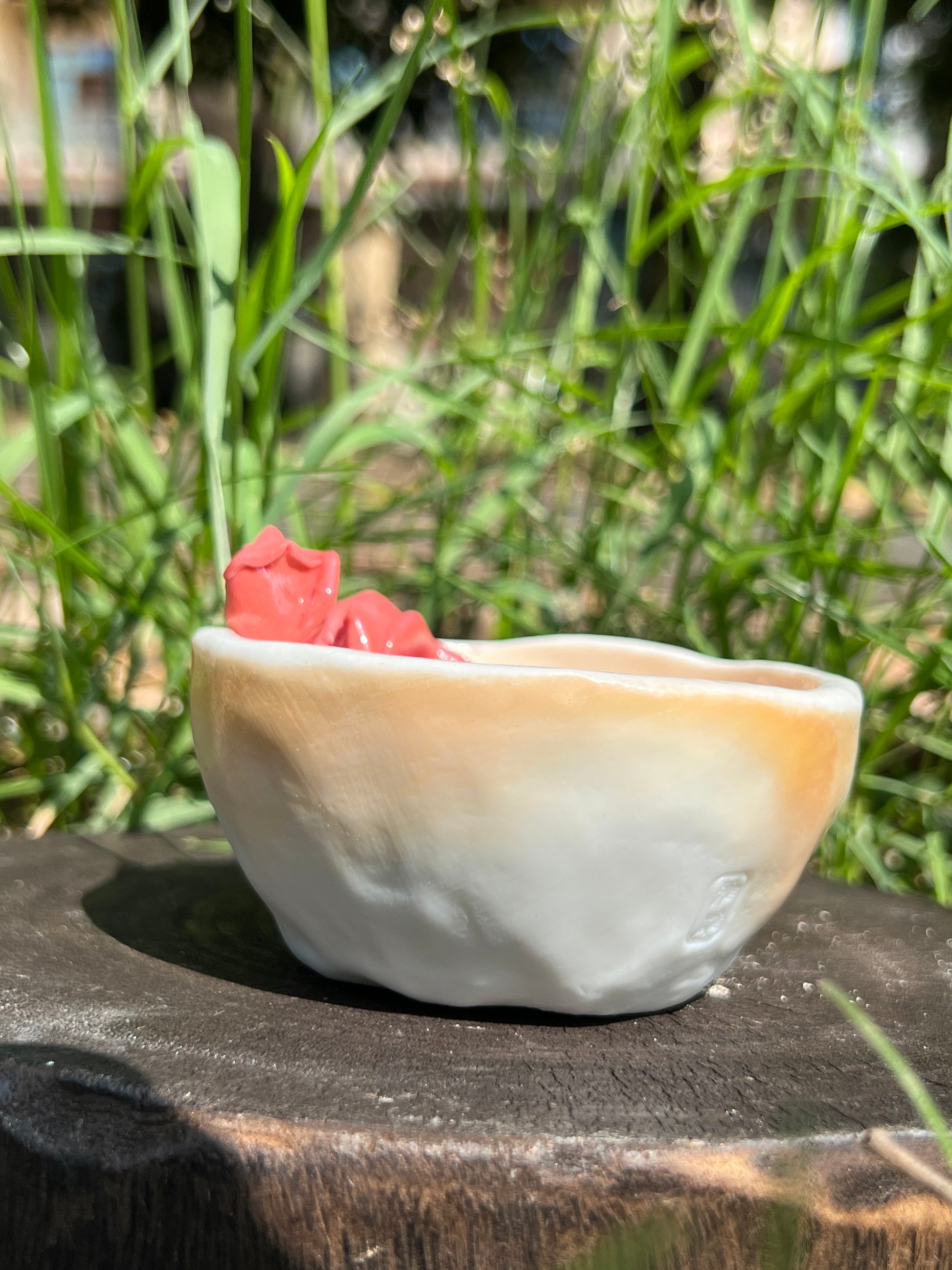 This is a woodfired pottery flower teacup