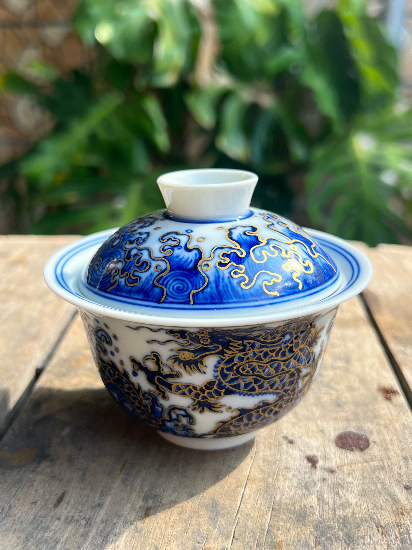 This is a Chinese Jingdezhen blue and white porcelain dragon teapot gaiwan