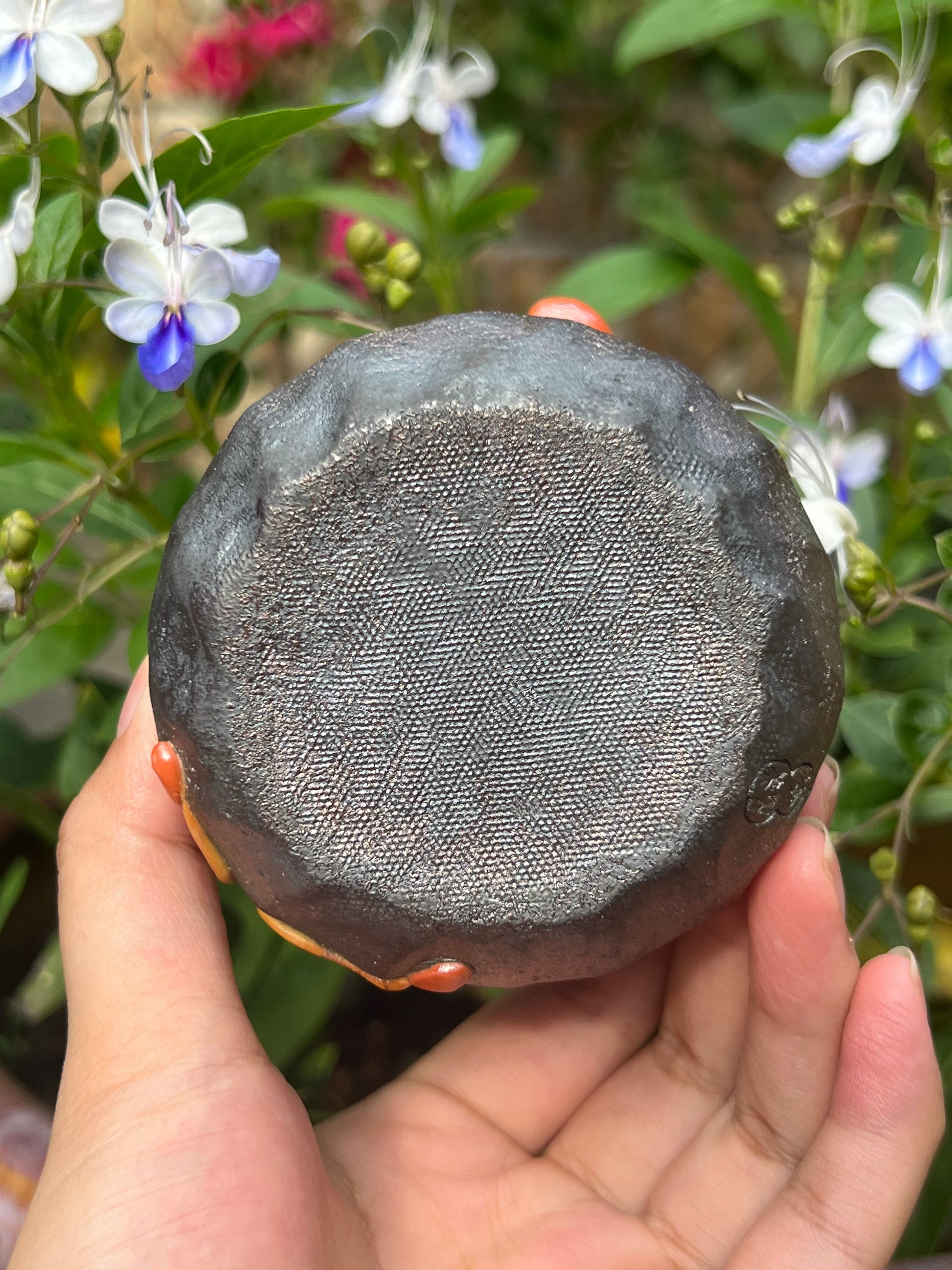 This is a woodfired tietai pottery flower teacup