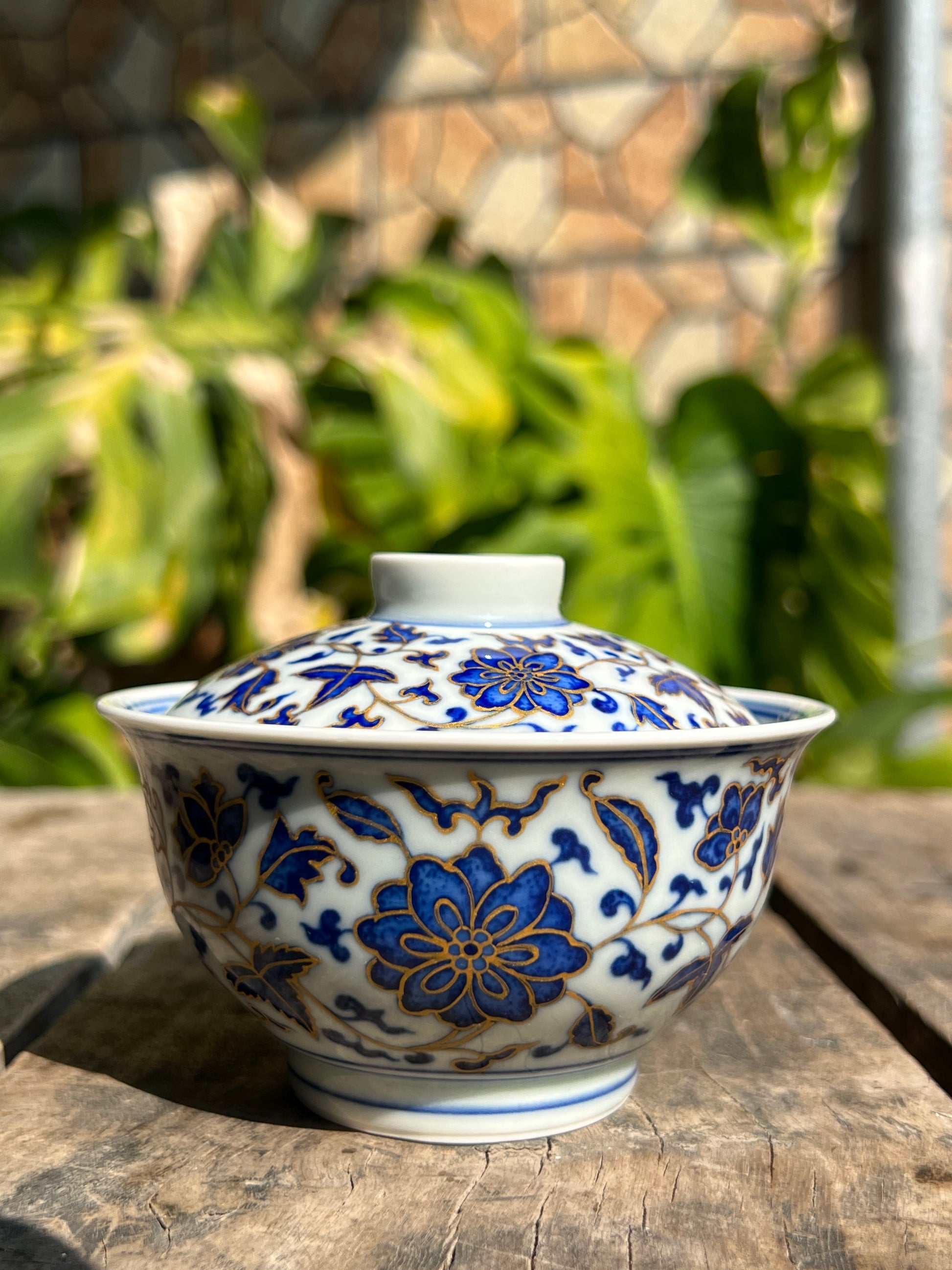 This is a Chinese Jingdezhen blue and white porcelain flower teapot gaiwan