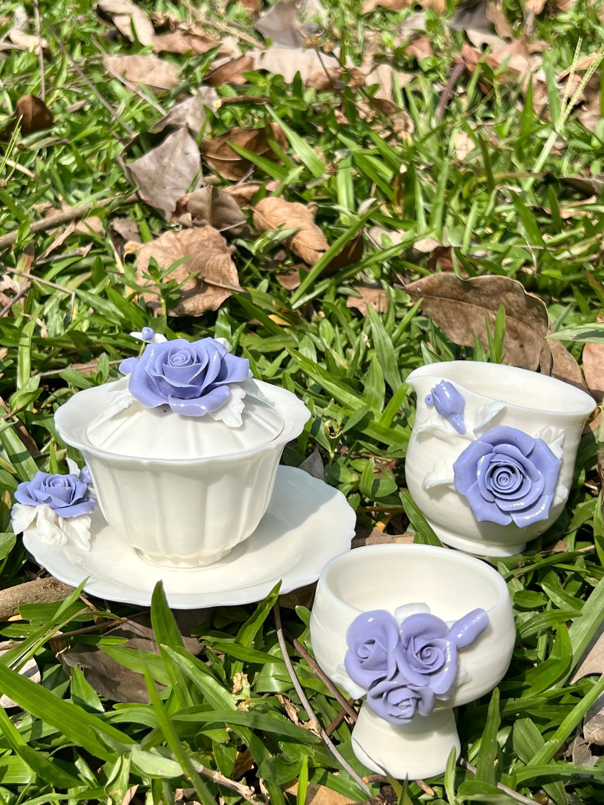 this is a woodfired white fine pottery flower teacup