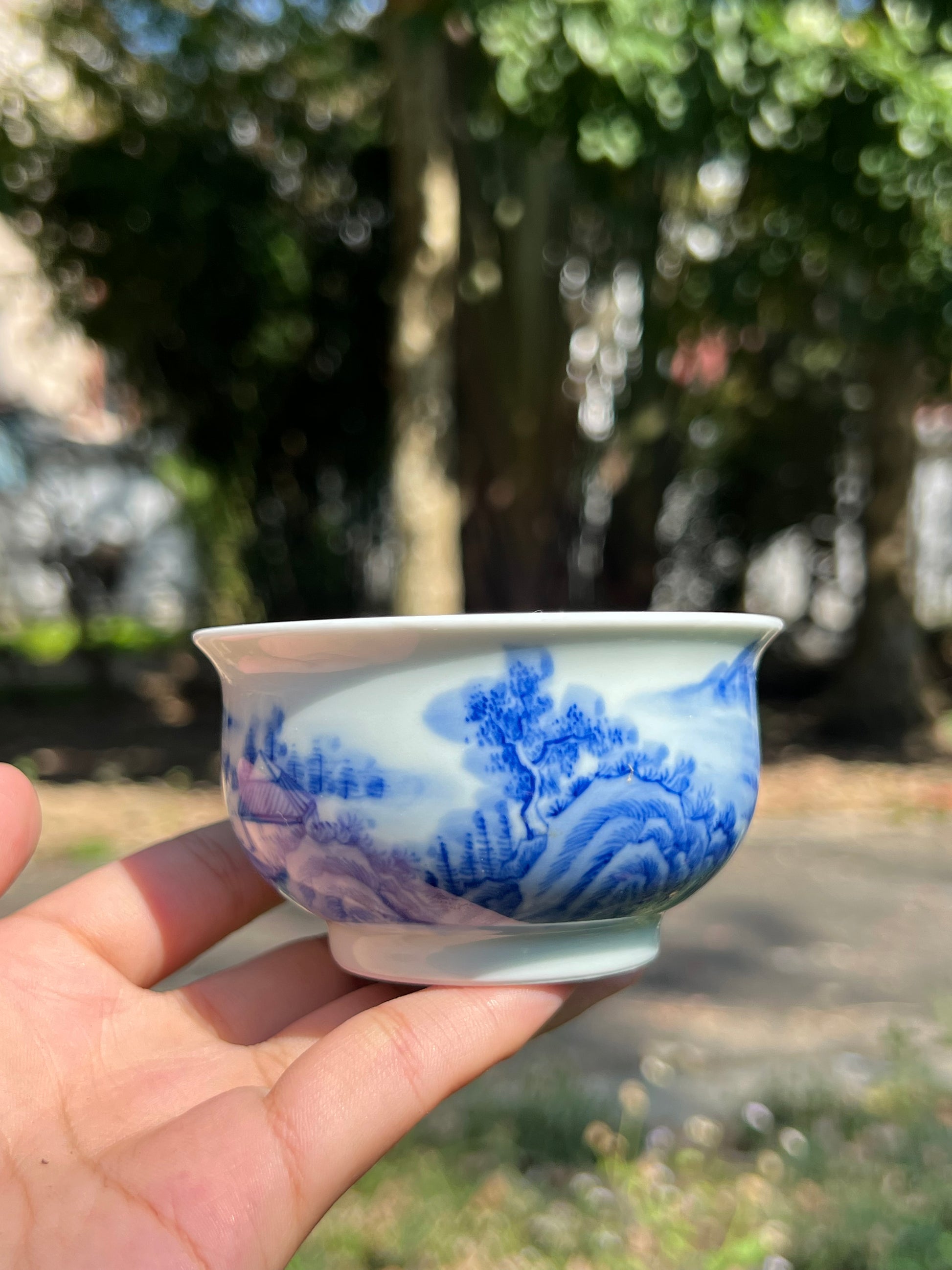 This is a Chinese Jingdezhen blue and white porcelain landscape teacup