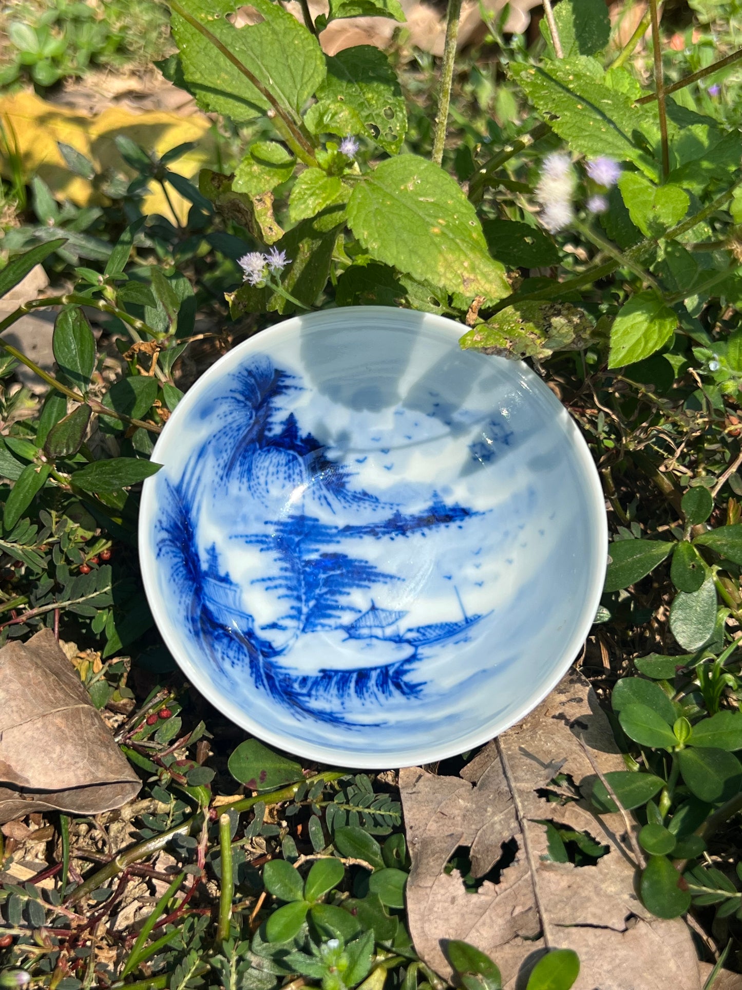 This is a Chinese Jingdezhen blue and white porcelain landscape teacup