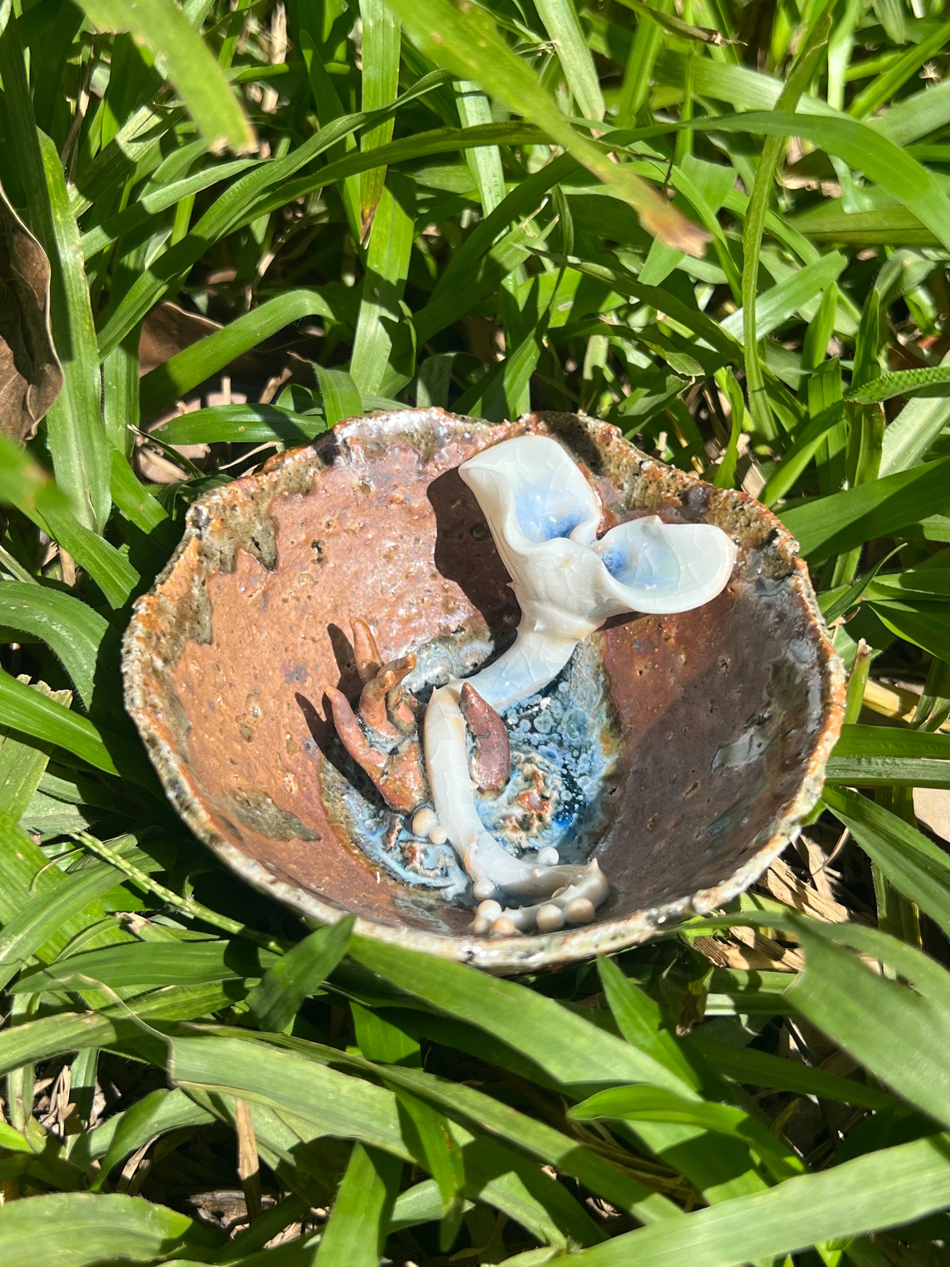 This is a woodfired pottery flower teacup