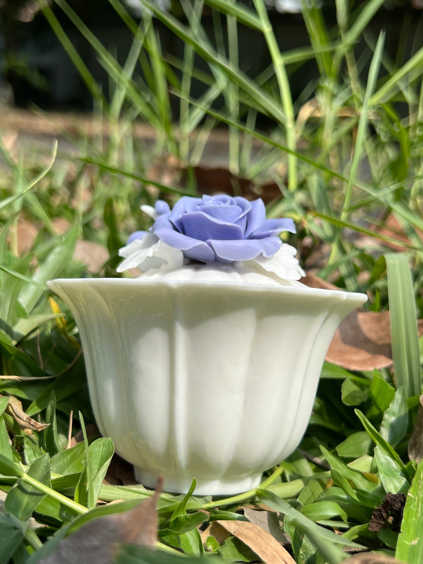 this is a woodfired white fine pottery flower teacup