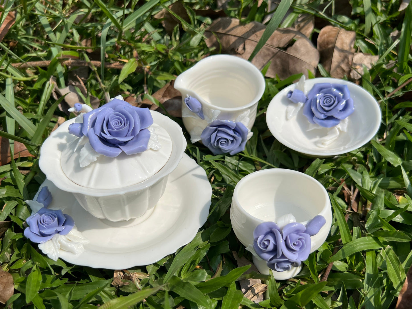 this is a woodfired white fine pottery flower teacup