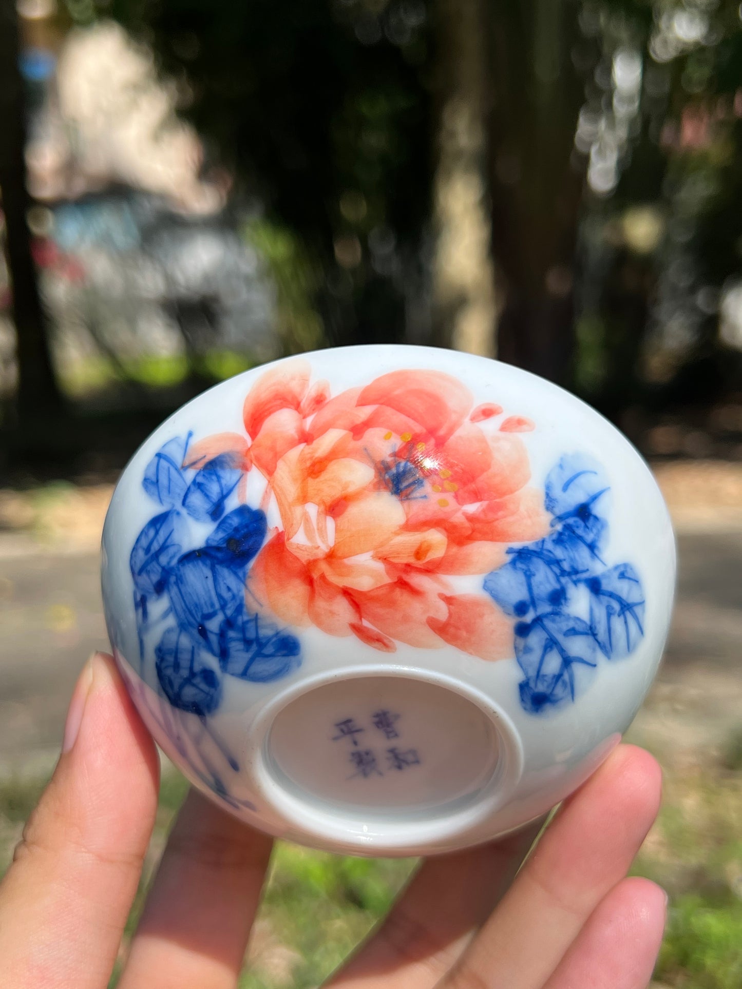 This is a Chinese Jingdezhen blue and white porcelain peony flower teacup