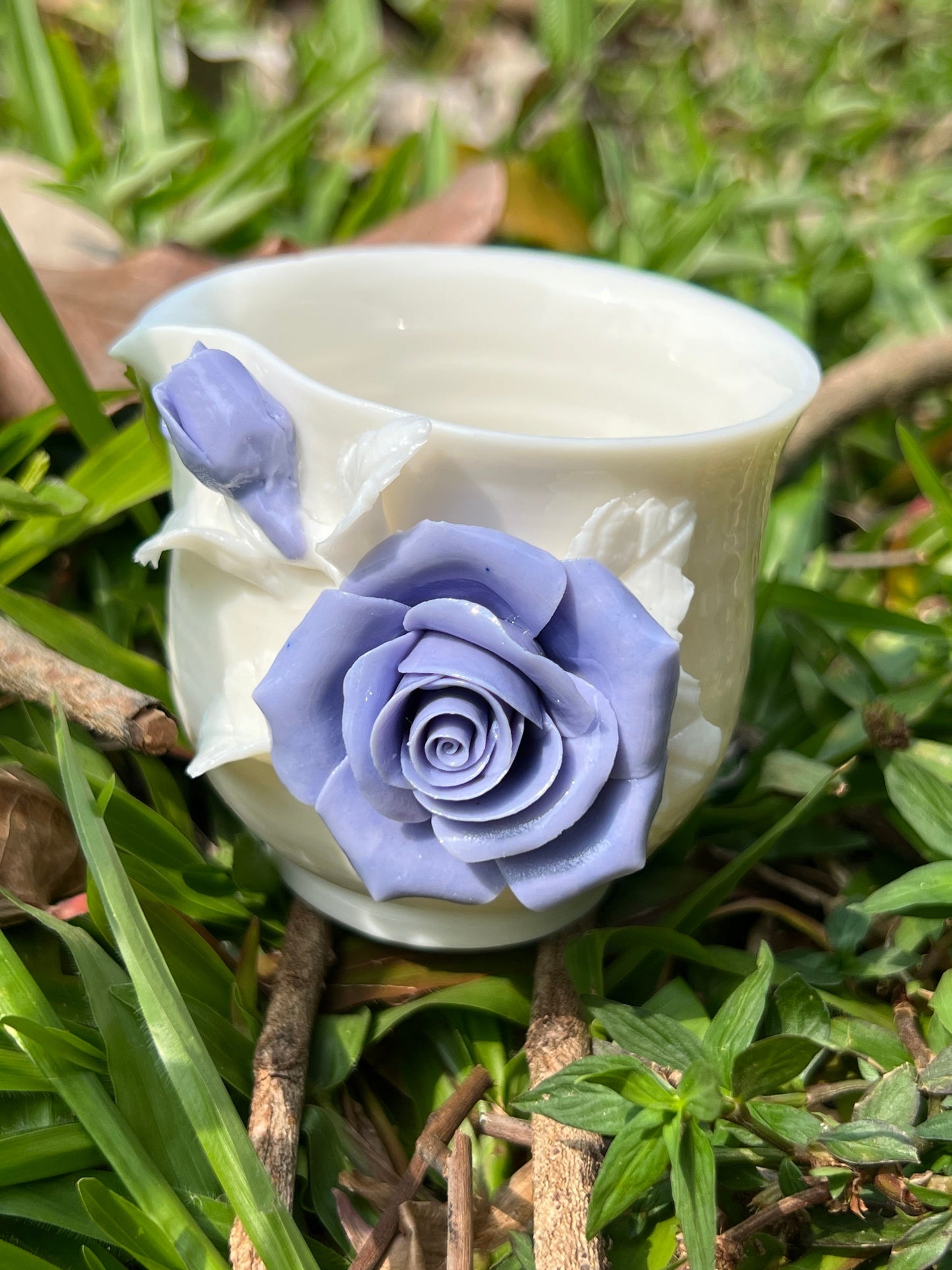 this is a woodfired white fine pottery flower teacup