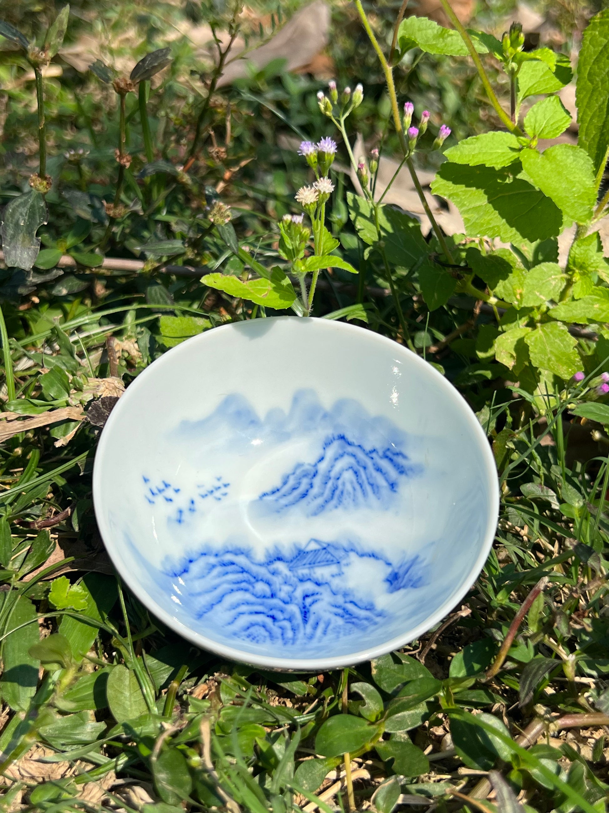 This is a Chinese Jingdezhen blue and white porcelain landscape teacup