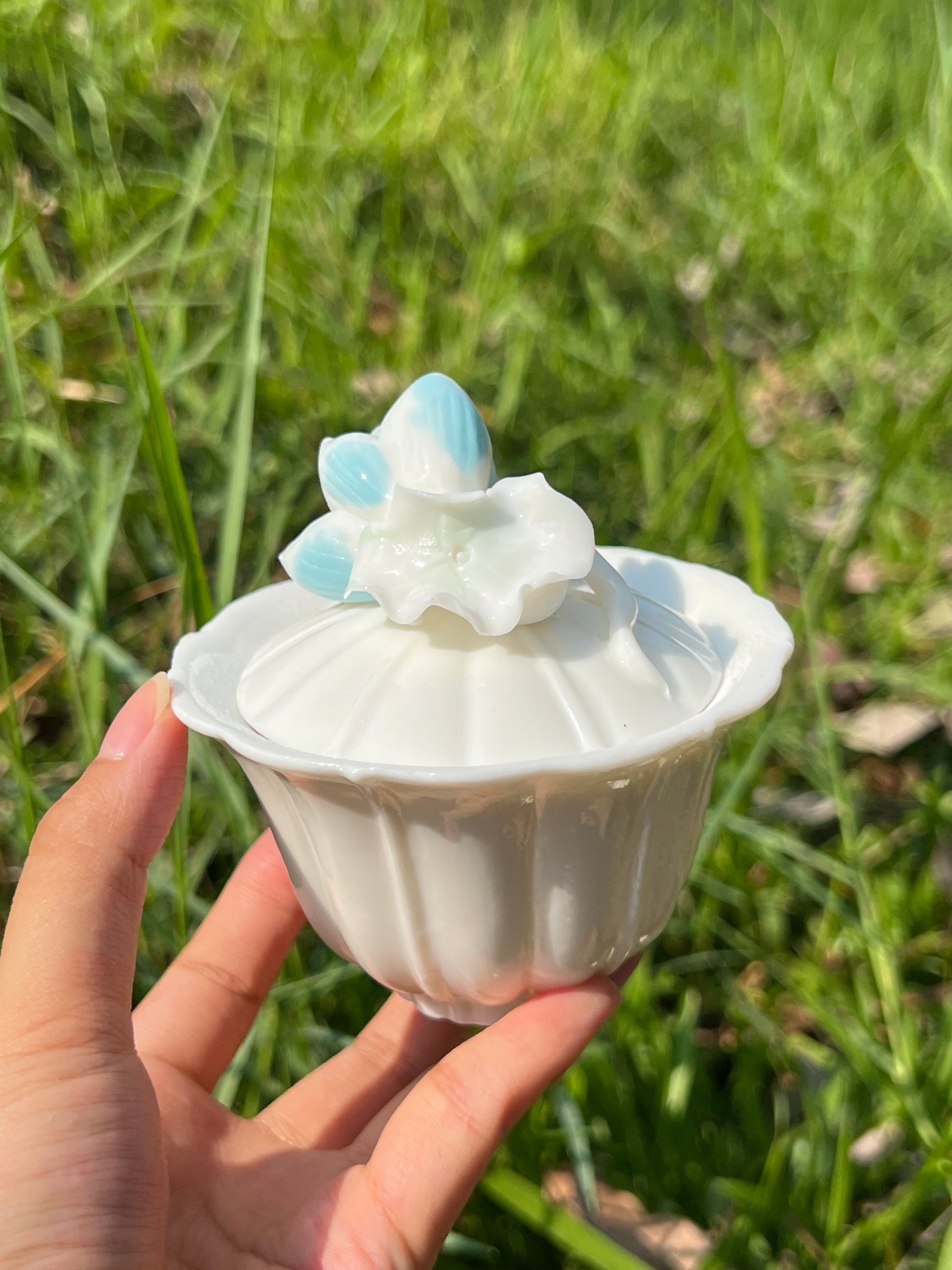 this is a woodfired white fine pottery flower teacup