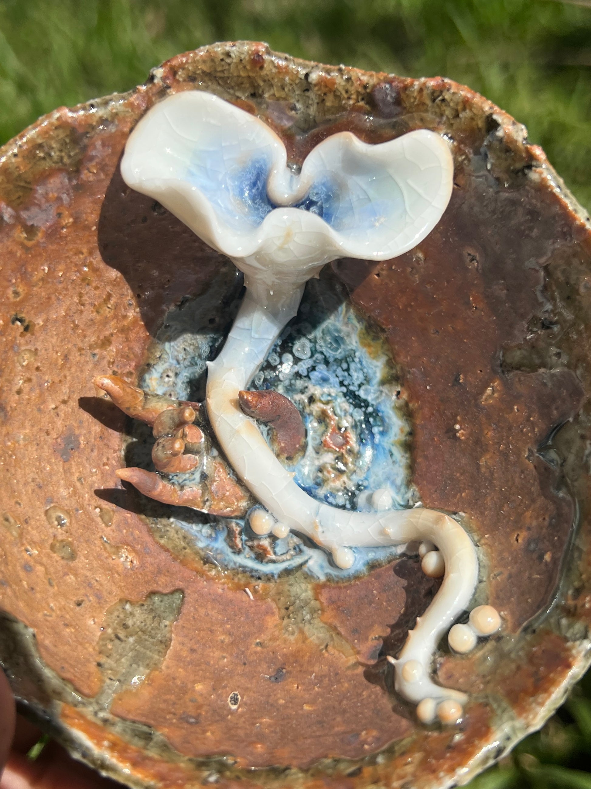 This is a woodfired pottery flower teacup