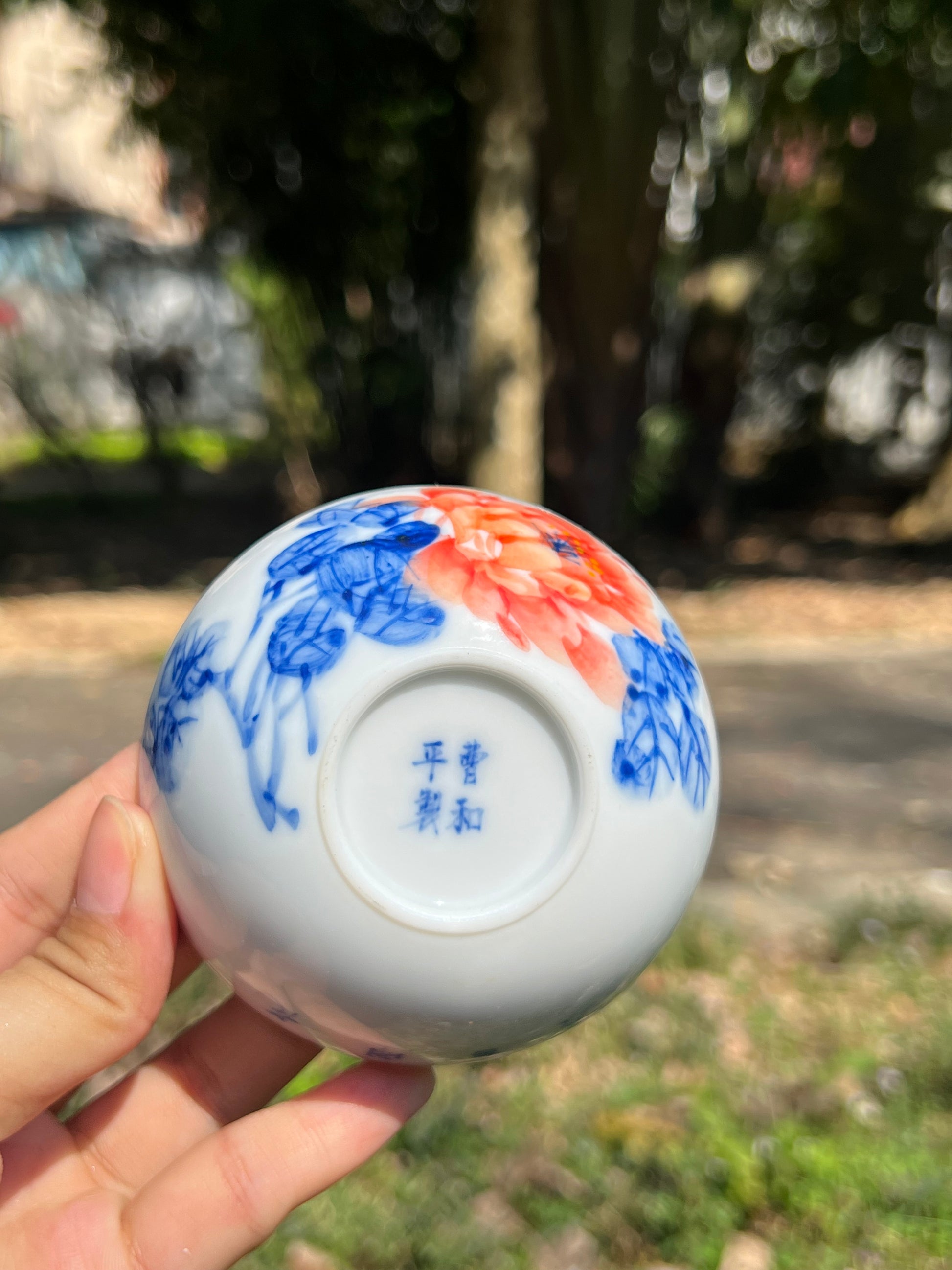 This is a Chinese Jingdezhen blue and white porcelain peony flower teacup