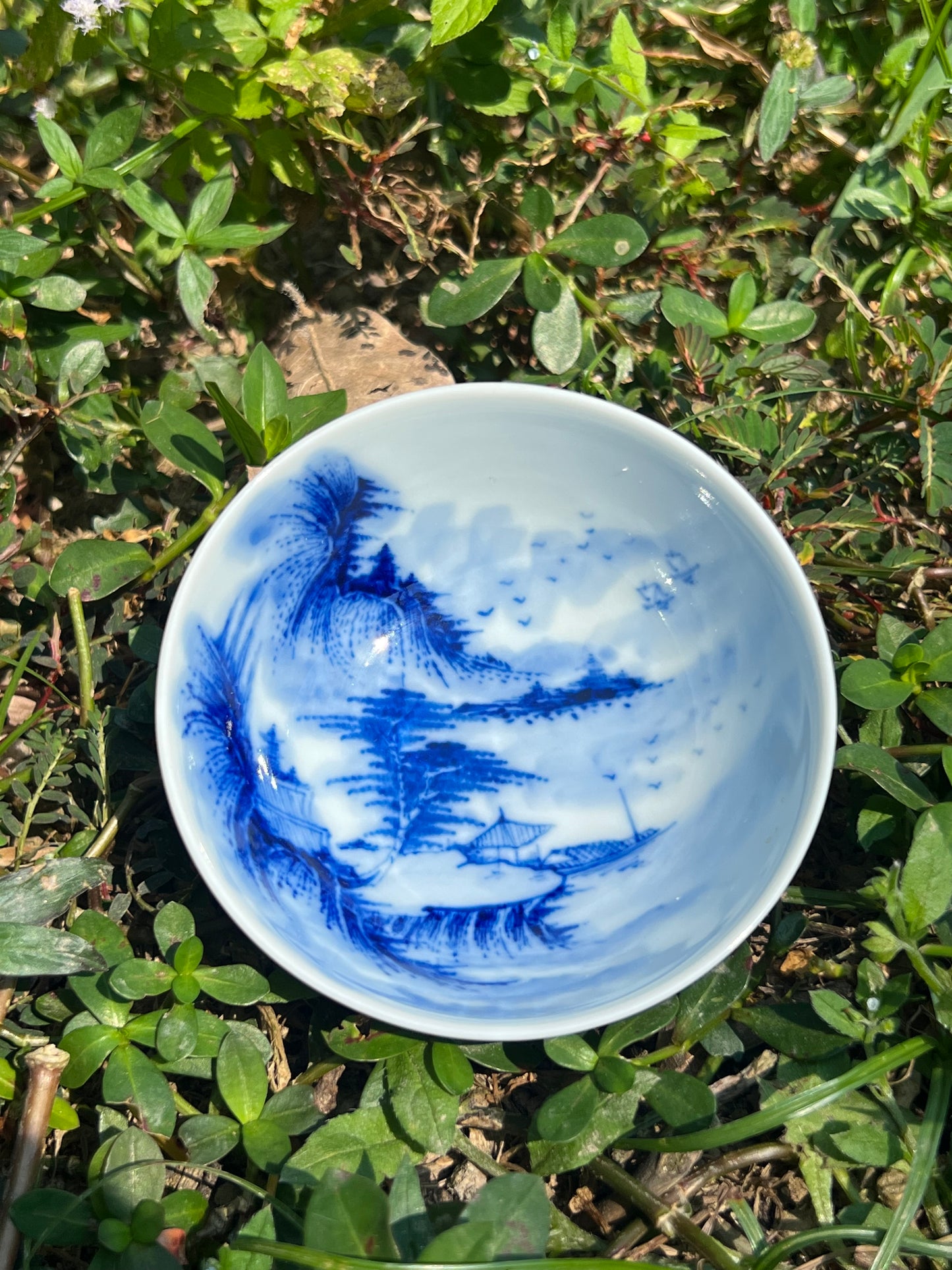 This is a Chinese Jingdezhen blue and white porcelain landscape teacup