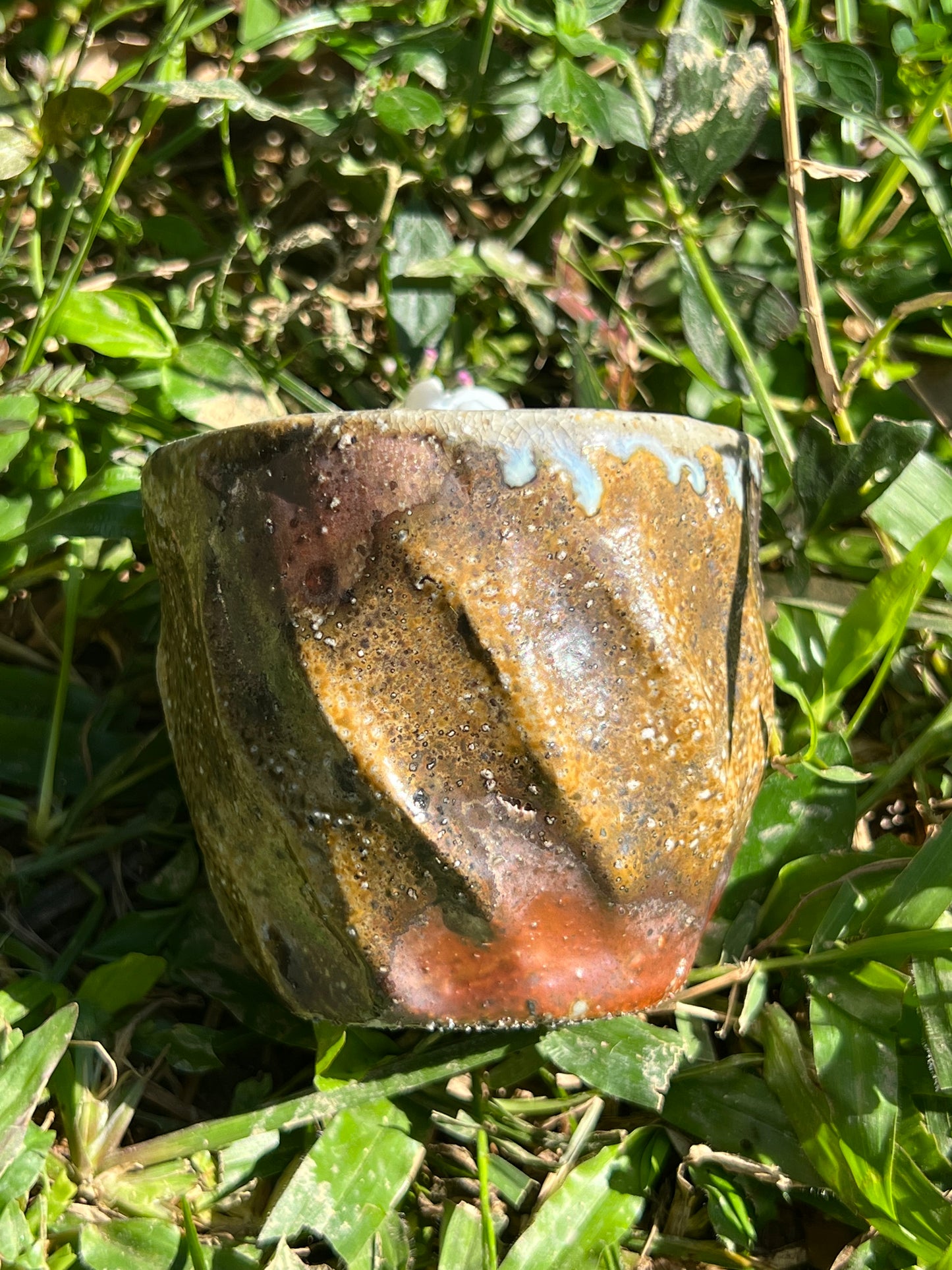 This is a woodfired pottery flower teacup