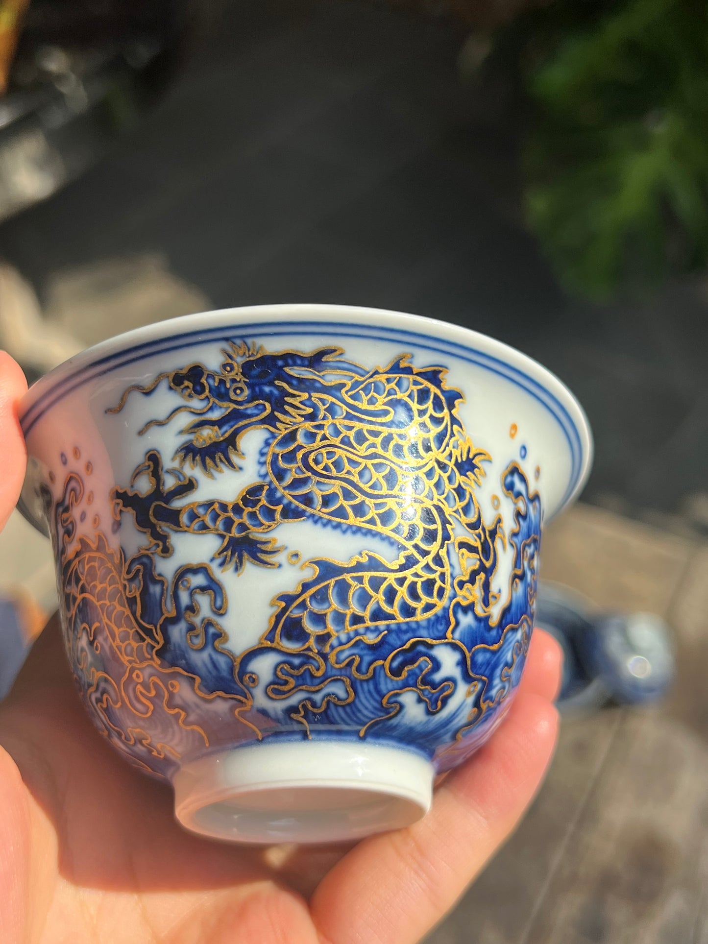 This is a Chinese Jingdezhen blue and white porcelain dragon teapot gaiwan