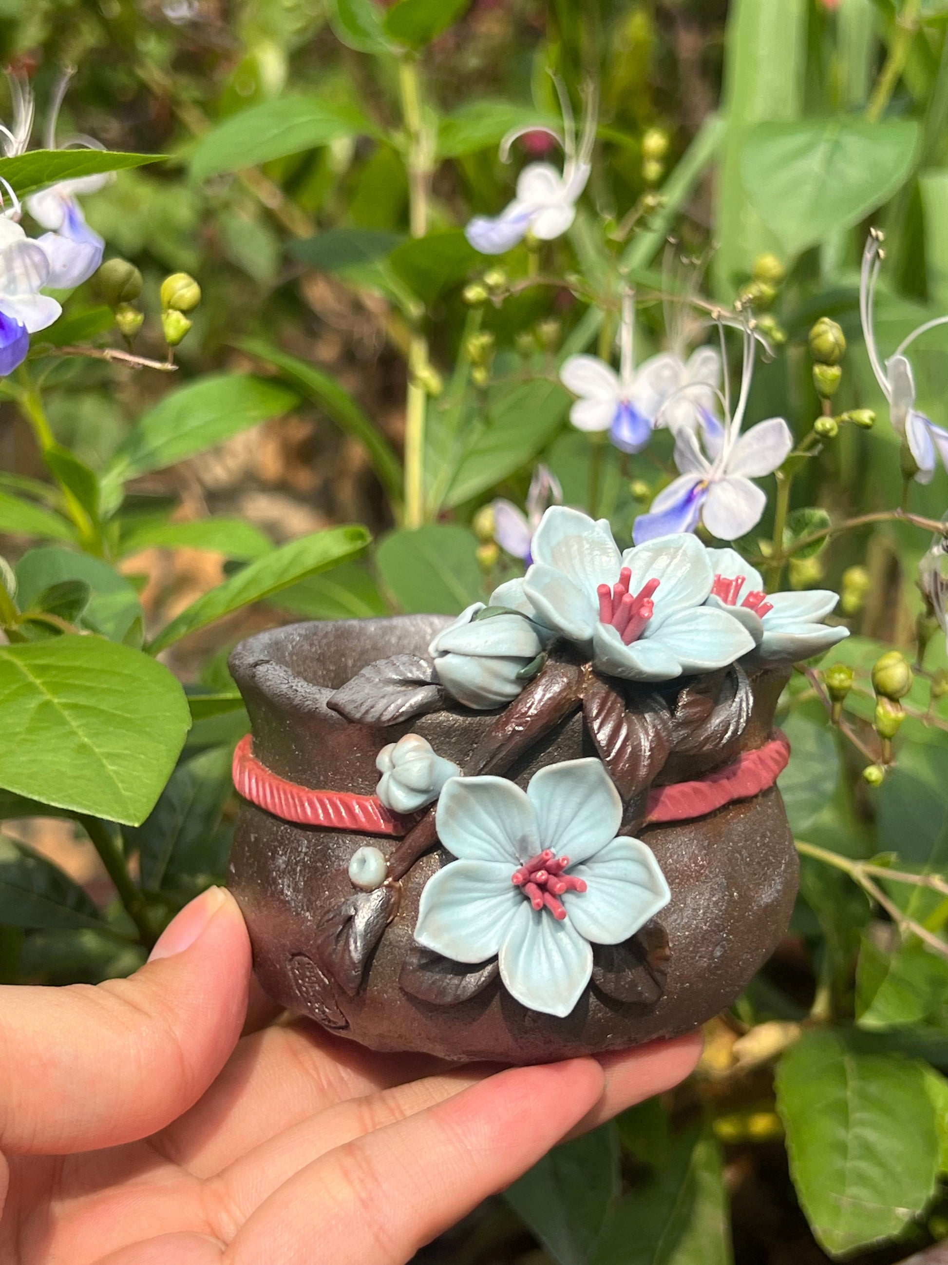 This is a woodfired tietai pottery flower teacup