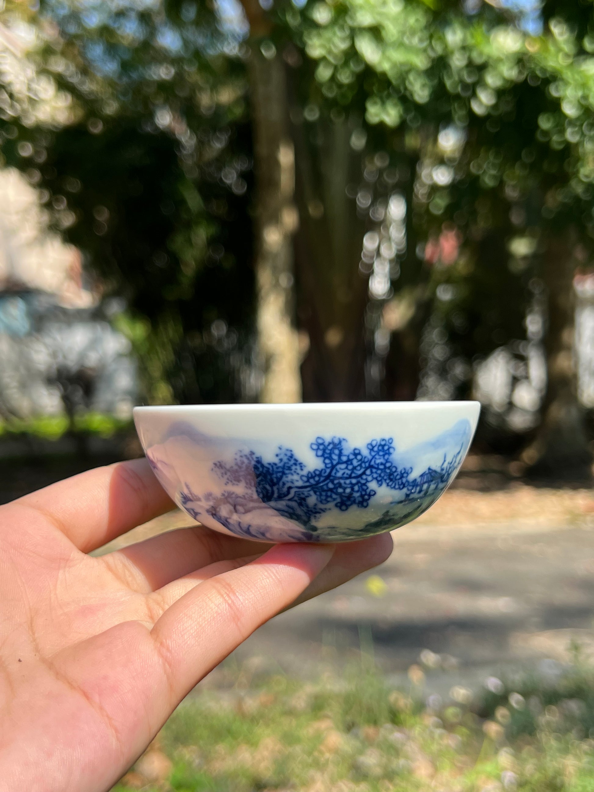 This is a Chinese Jingdezhen blue and white porcelain landscape teacup