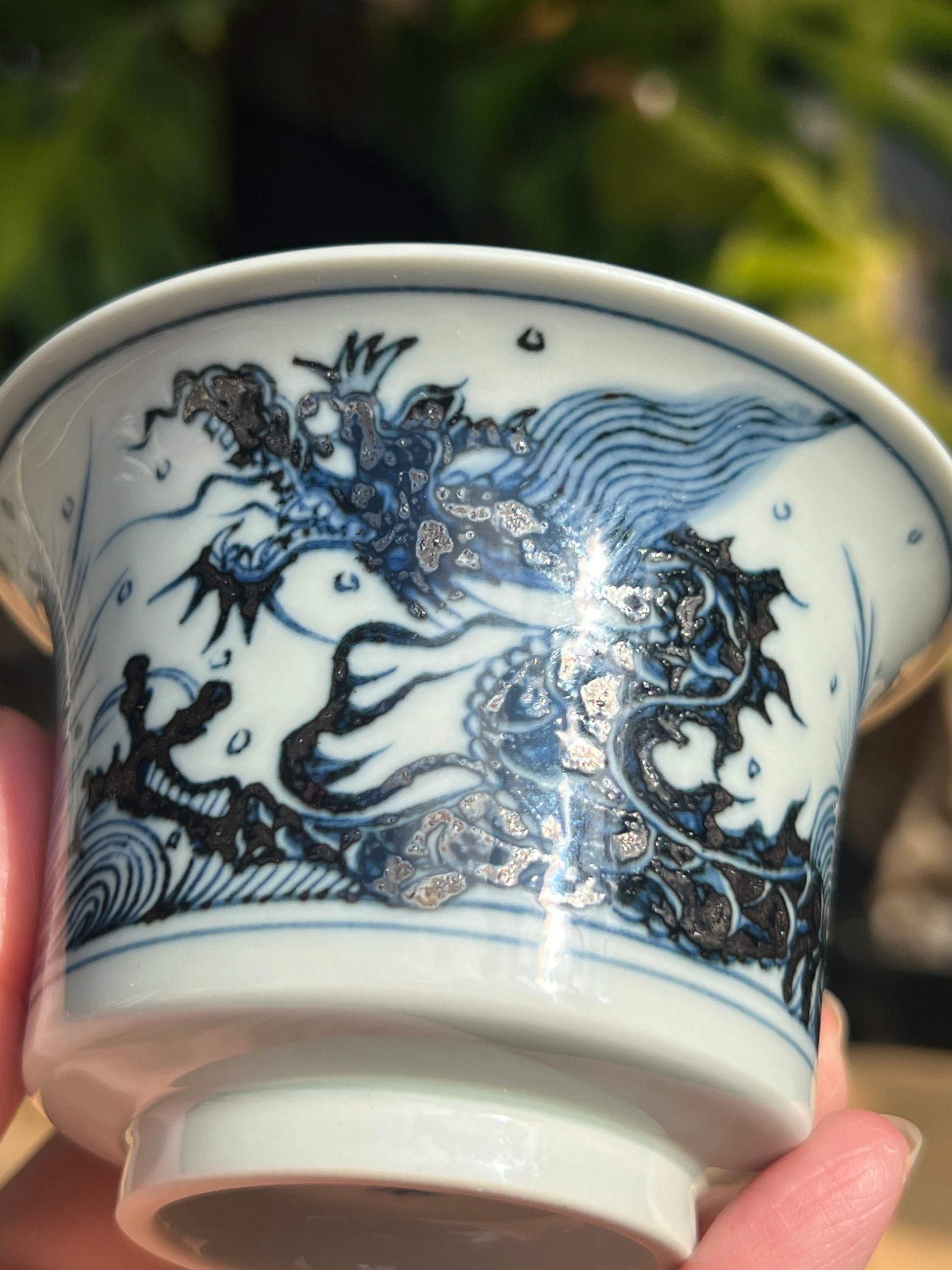 This is a Chinese Jingdezhen blue and white porcelain dragon teapot gaiwan