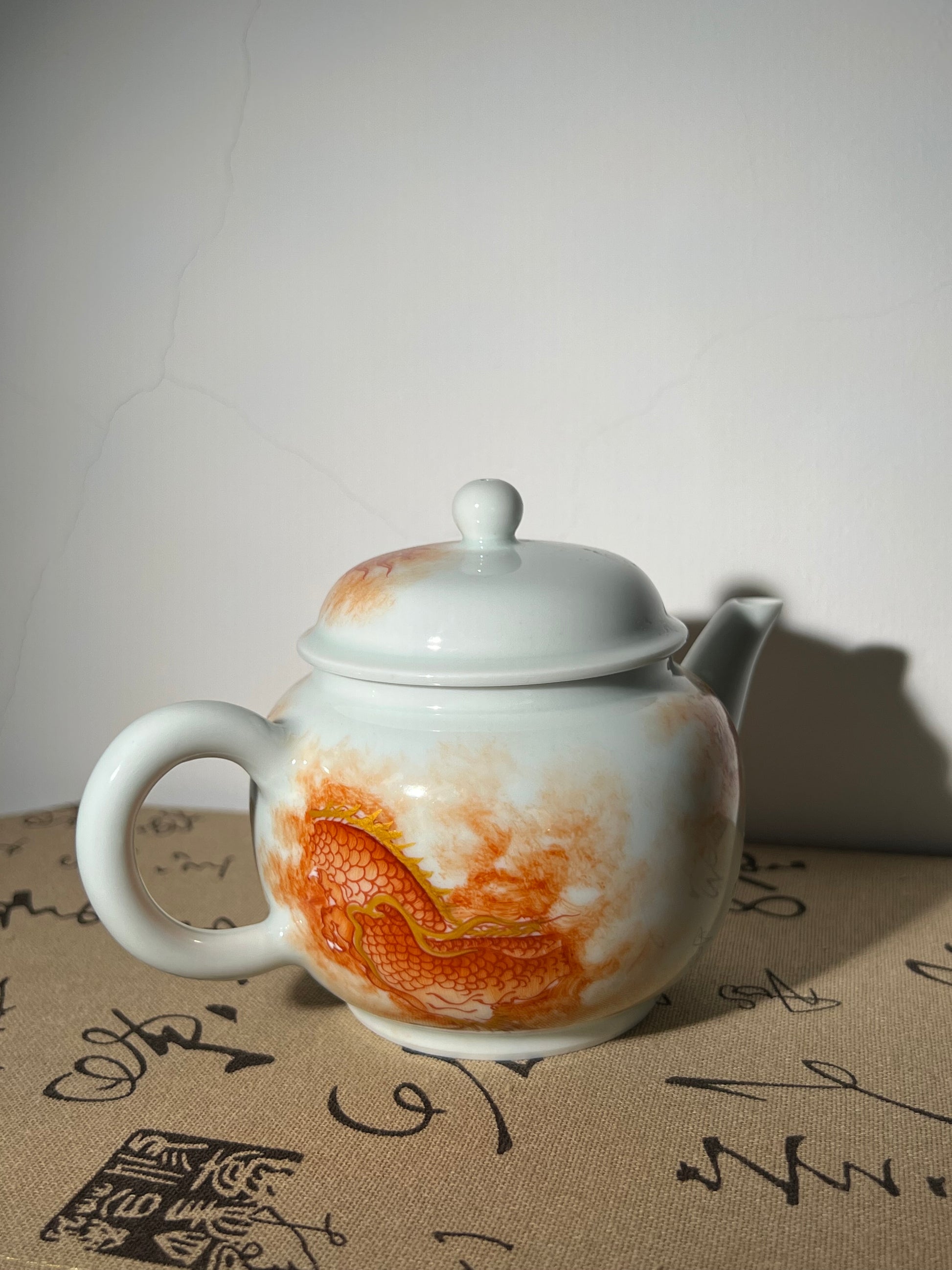 this is a Chinese Jingdezhen alum red dragon phoenix teapot.this is a ceramic teapot